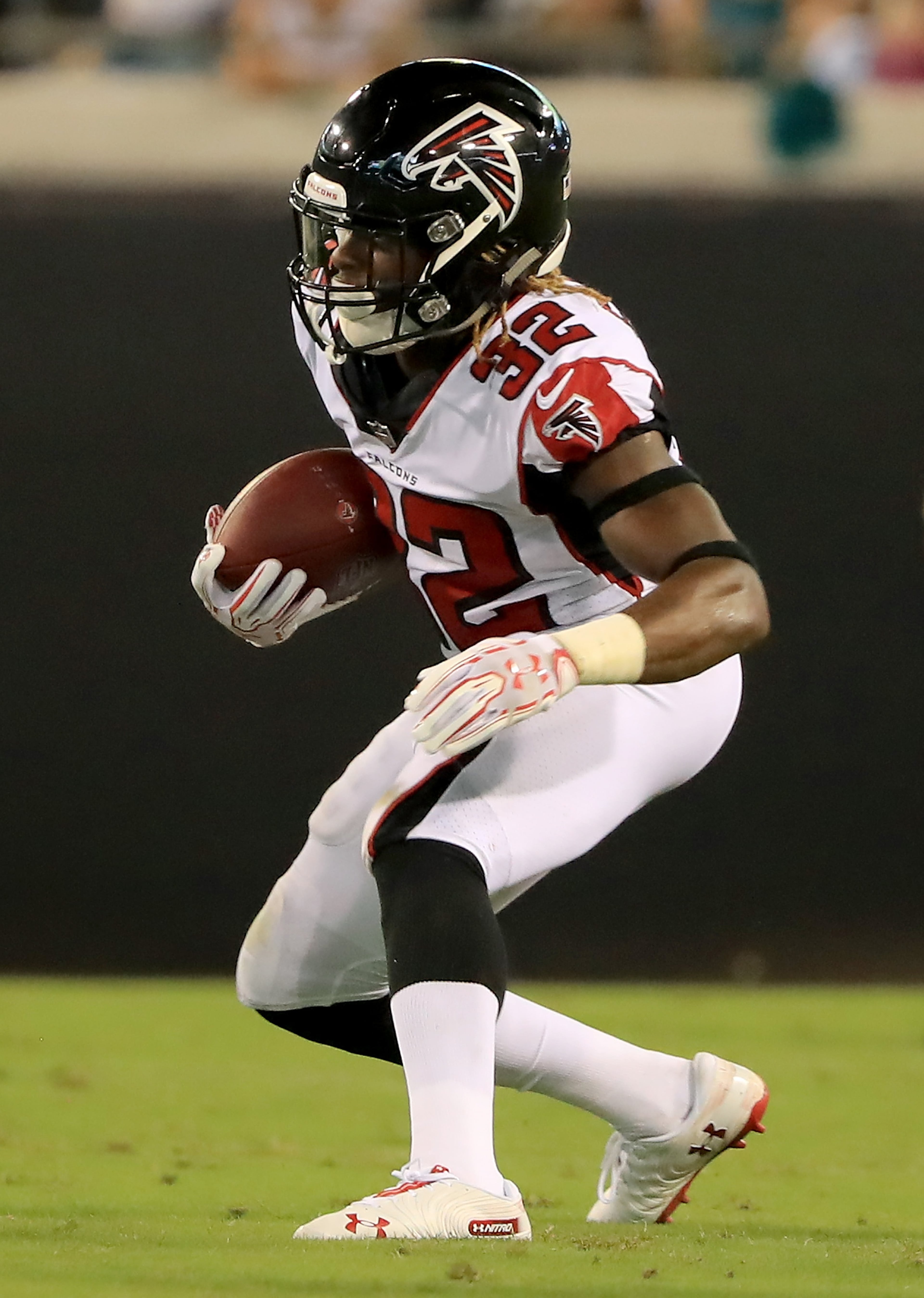 JACKSONVILLE, FL - AUGUST 25: Justin Crawford #32 of the Atlanta Falcons runs for yardage during a preseason game against the Jacksonville Jaguars at TIAA Bank Field on August 25, 2018 in Jacksonville, Florida. (Photo by Sam Greenwood/Getty Images)