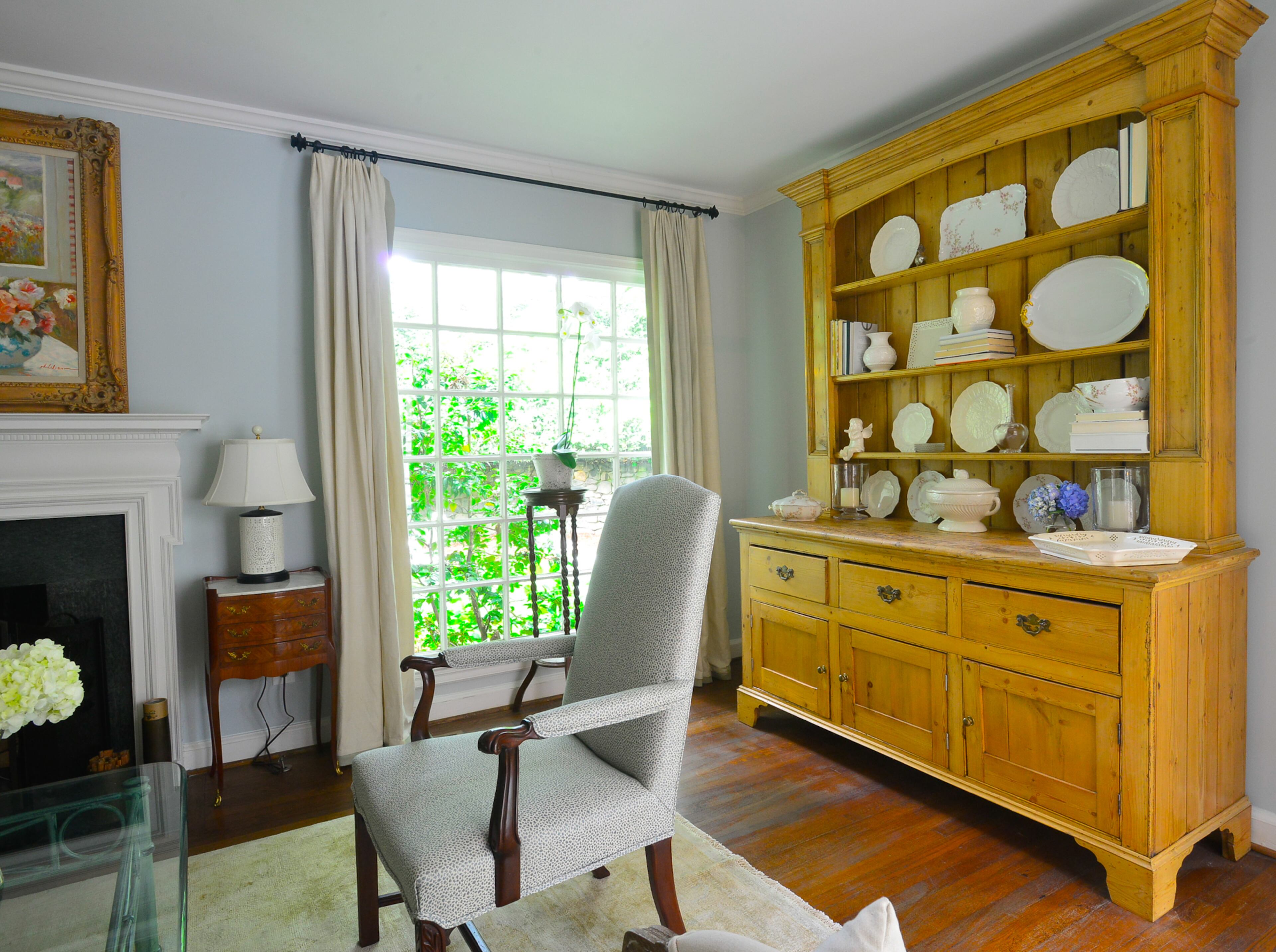 Many of the pieces in the couple's home are antiques inherited from family members or acquired at auctions. The pine hutch was custom made for Catherine Callaway's parents and handed down to them.