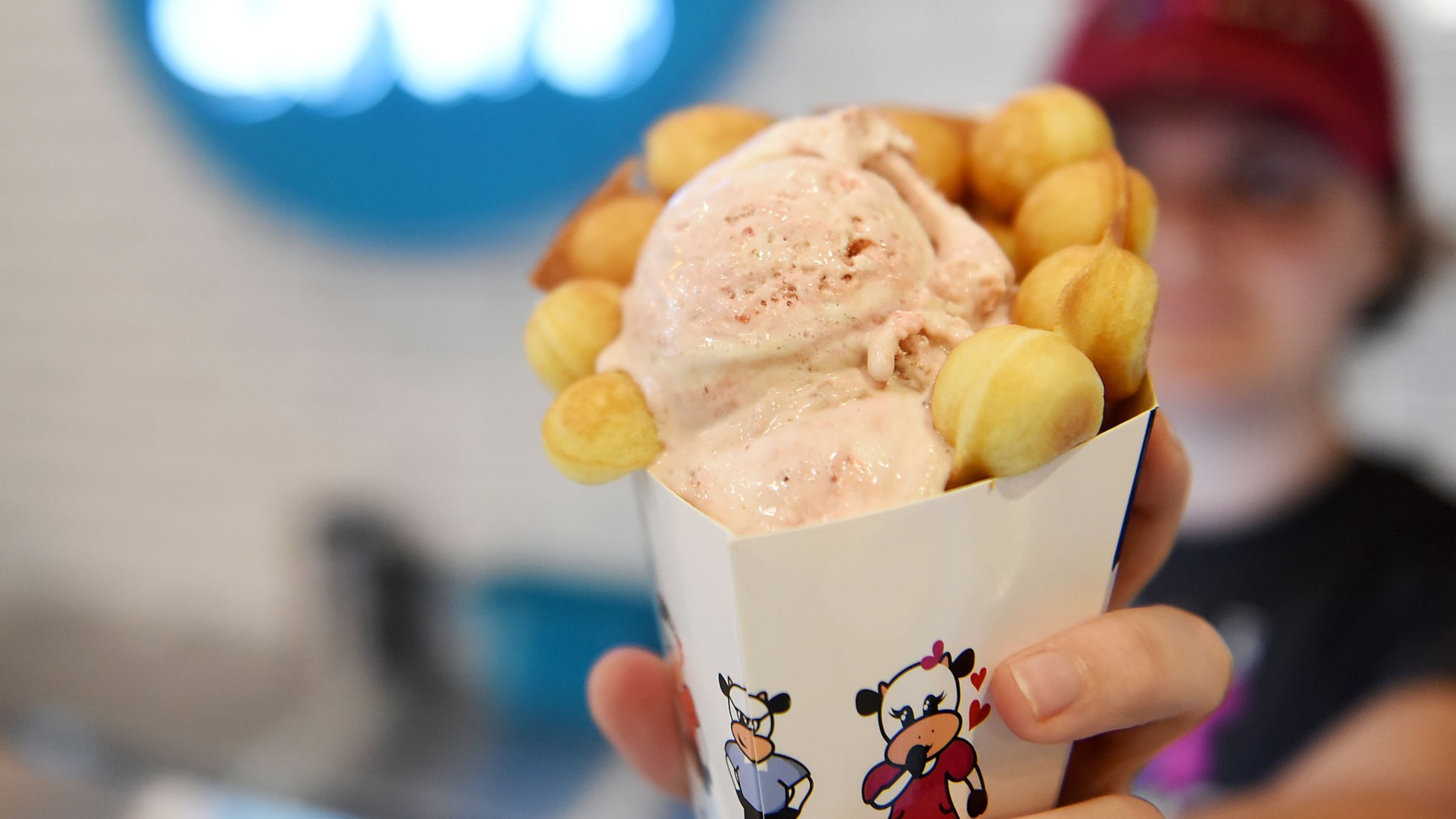 A Four Fat Cows ice cream cone is served up at Marietta Square Market. RYON HORNE / RHORNE@AJC.COM