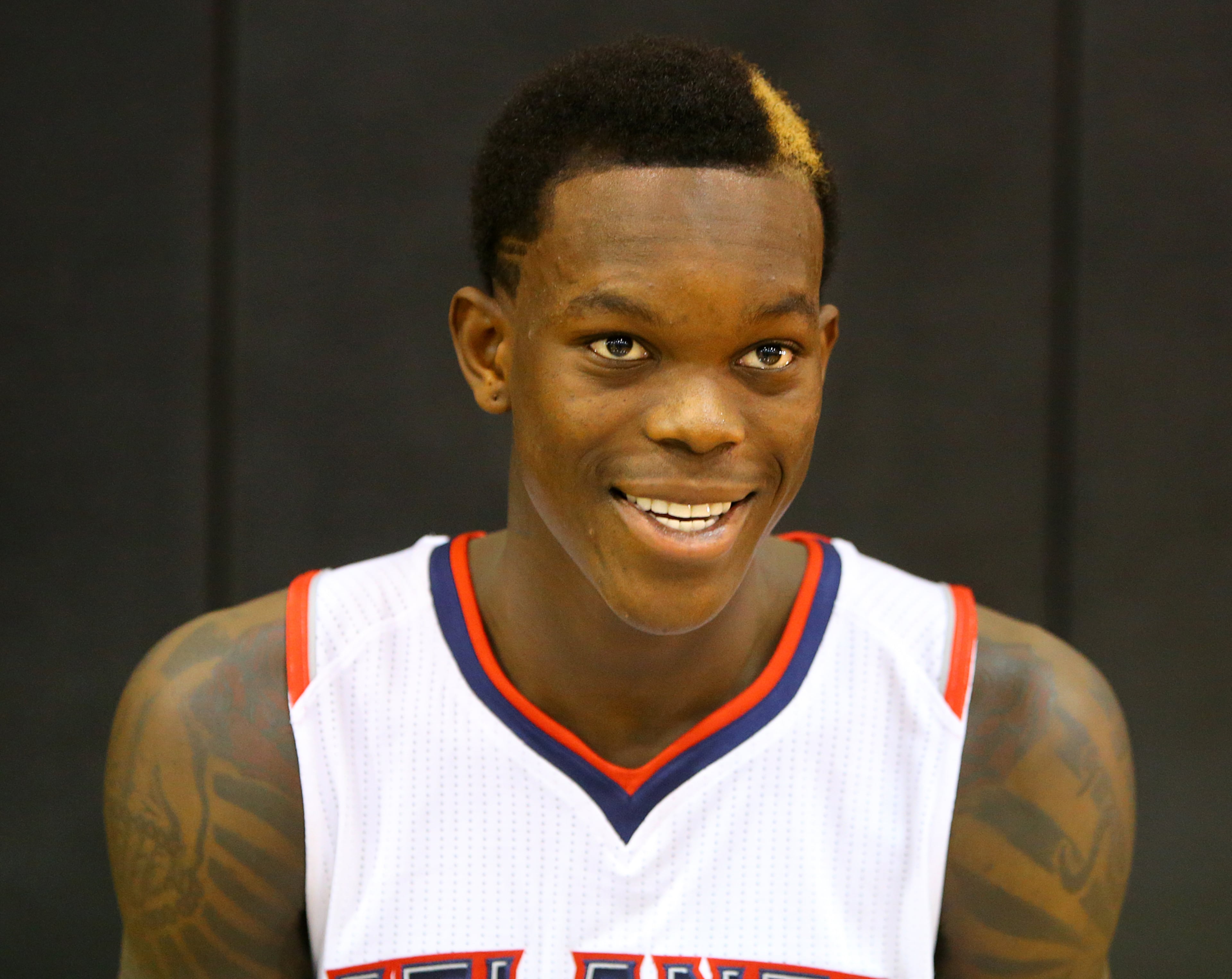 Hawks guard Dennis Schroder gives an interview during Media Day at Philips Arena on Monday, Sept. 29, 2014. CURTIS COMPTON / CCOMPTON@AJC.COM