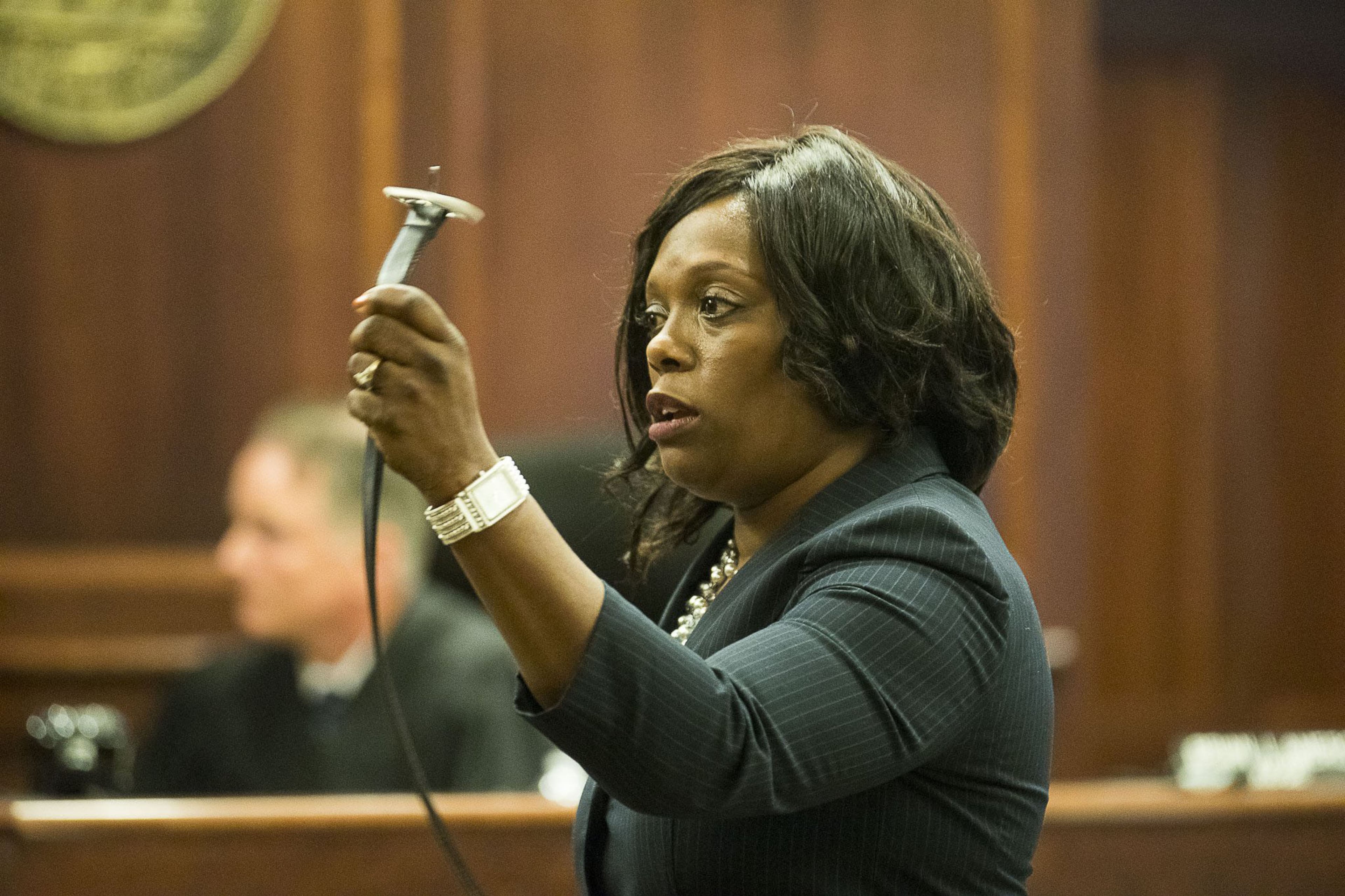 DeKalb County Assistant District Attorney Daysha Young uses a belt to demonstrate an example of physical abuse while giving her closing arguments during the trial of Jennifer and Joseph Rosenbaum in front of Henry County Judge Brian Amero at the Henry County Superior Court in McDonough on July 26, 2019. The trial began on July 8. The DeKalb County district attorney's office is prosecuting the case because the Henry County DA's office recused itself. Jennifer Rosenbaum once worked as an intern for the Henry DA. (Alyssa Pointer/alyssa.pointer@ajc.com)