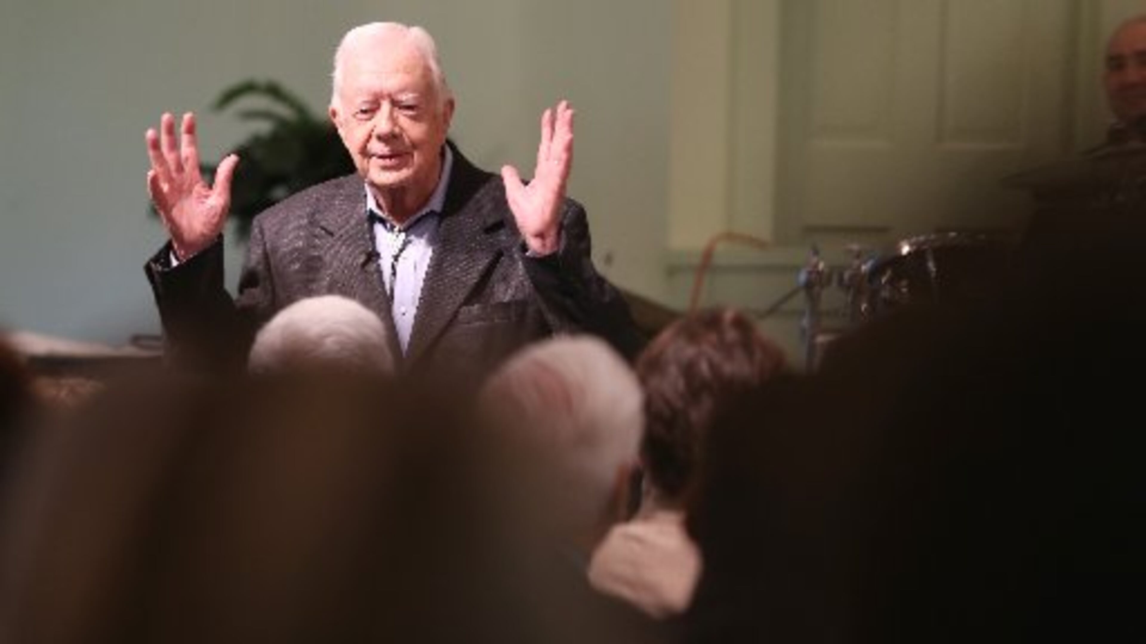 President Jimmy Carter talks to the overflow crowd at Maranatha Baptist Church in Plains on Sunday morning August 23, 2015 before teaching Sunday school. On Wednesday night, he’ll face a different audience when he answers questions from Emory University freshmen. Ben Gray / bgray@ajc.com