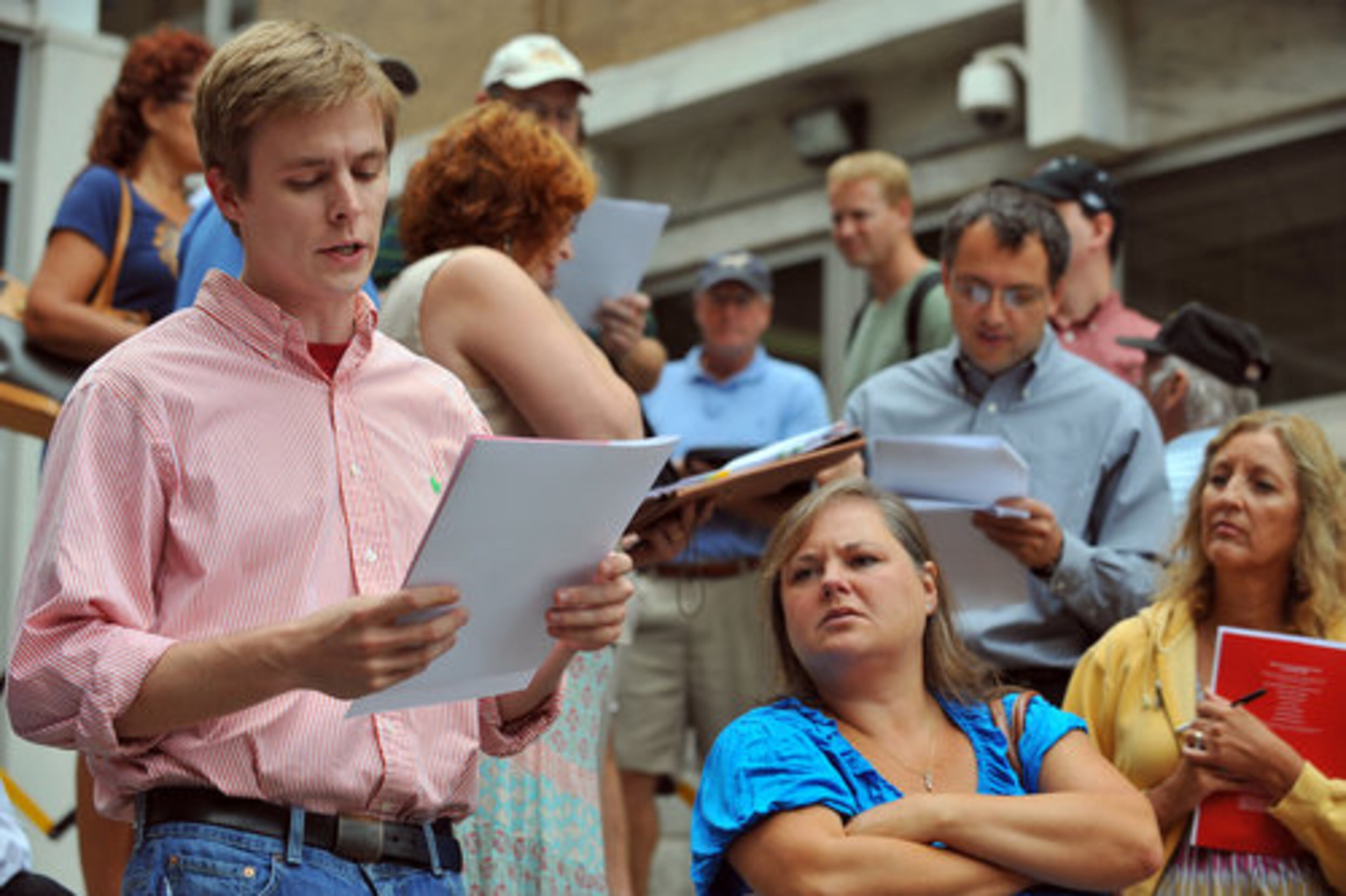 Van Clements, left, and other criers auction off property on the Cobb County Courthouse steps. More than 9,000 properties were scheduled to be auctioned Tuesday in the 13 metro-county area of Atlanta.