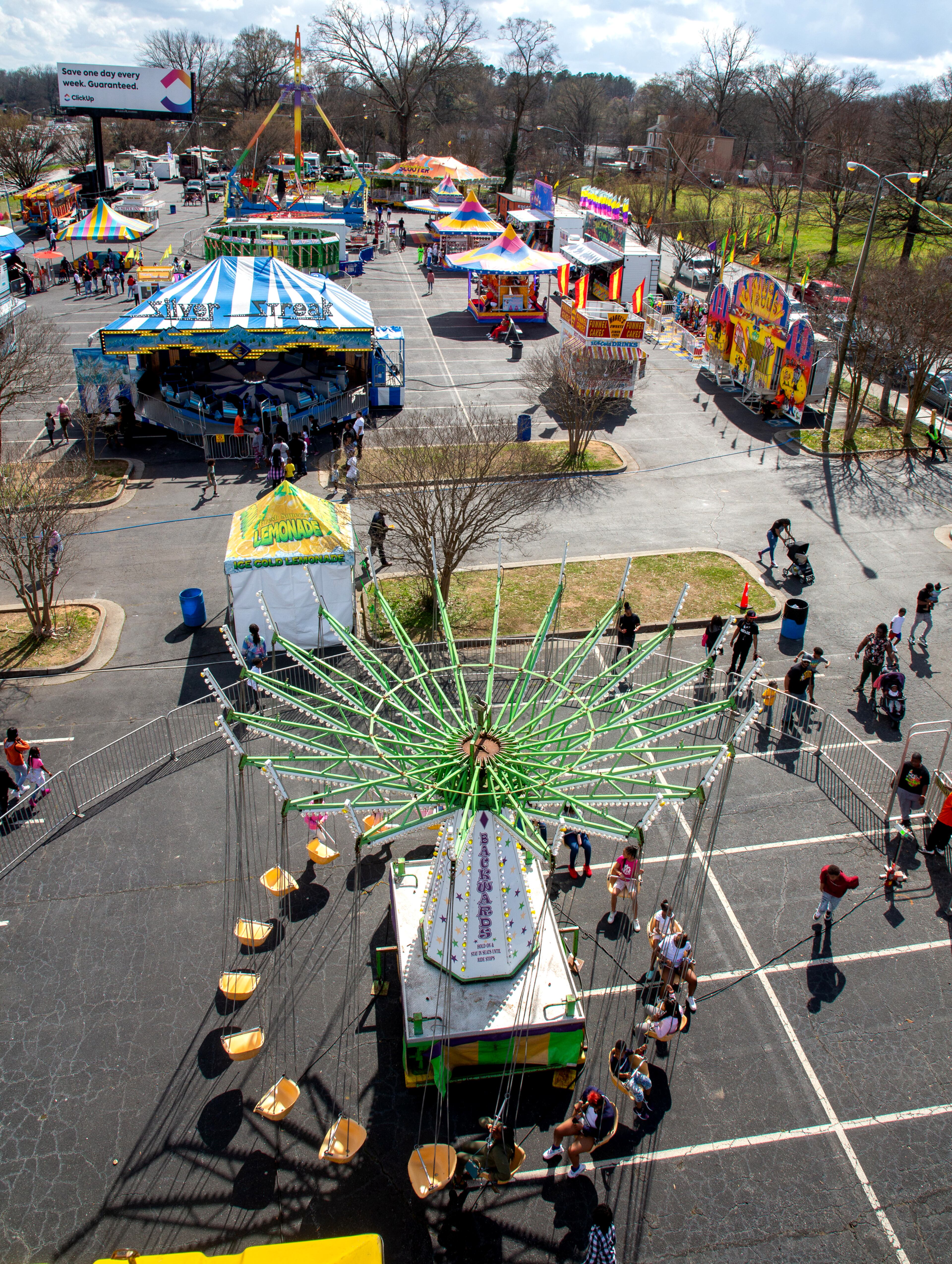 People walk around the Atlanta Fair near Center Parc Credit Union Stadium on Sunday, March 6, 2022. This was the opening weekend for the annual fair that runs through April 10. (Photo by Steve Schaefer for The Atlanta Journal-Constitution)