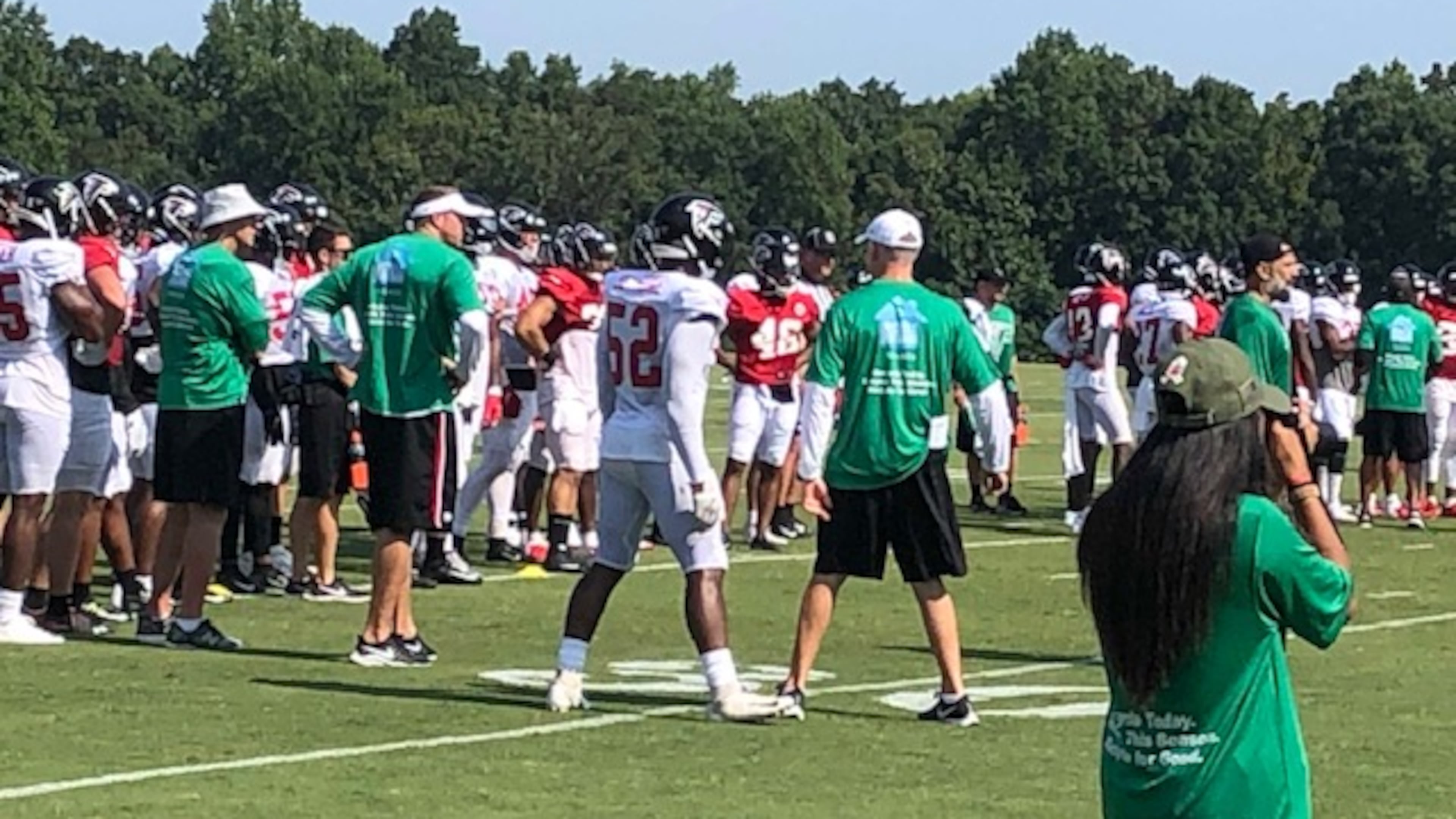 The Falcons staff was wearing green shirts to promote re-cycling. (By D. Orlando Ledbetter/dledbetter@ajc.com)