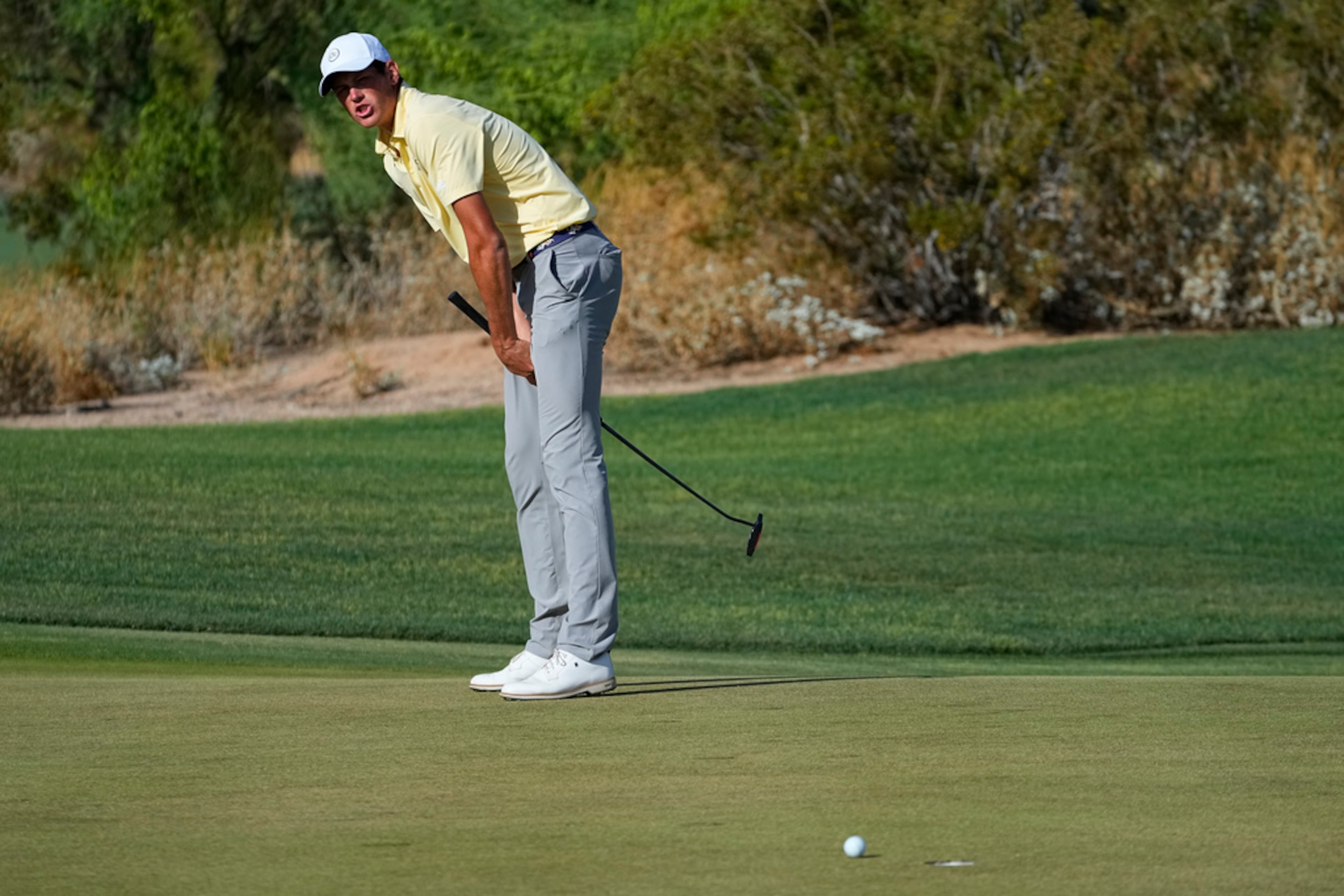 Georgia Tech golfer Christo Lamprecht reacts to missing his putt on the 15th green during the final round of the NCAA college men's match play golf championship against Florida golfer Yuxin Lin, Wednesday, May 31, 2023, in Scottsdale, Ariz. Florida won 3-1. (AP Photo/Matt York)