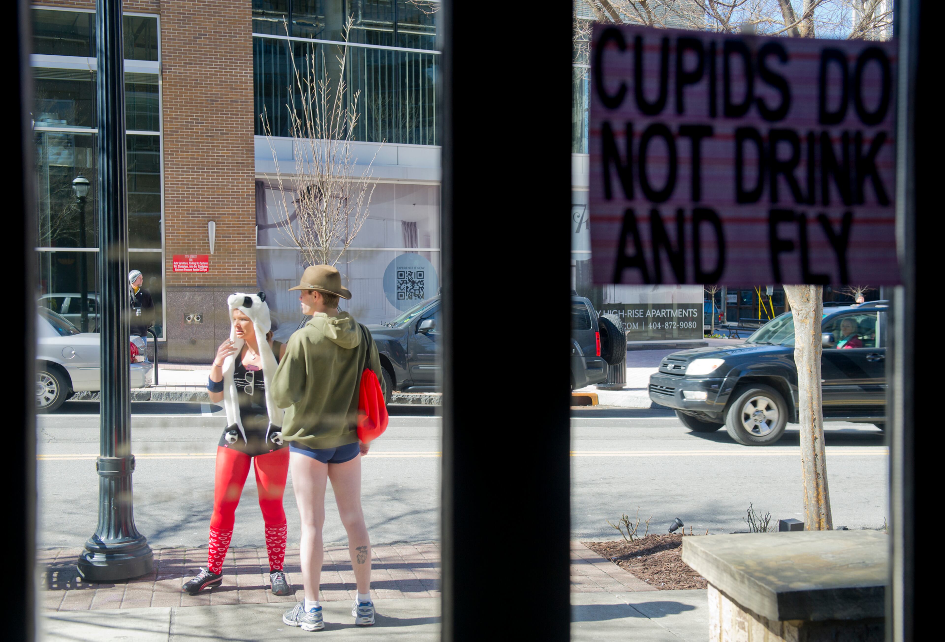 Allison Alford (left) talks to Nate Ohs outside Ri Ra Irish Pub before the start of the Cupid Undies Run in Midtown on Saturday, February 15, 2014. Hundreds of people came out in their undies for the third annual run which raises money for the Children's Tumor Foundation. JONATHAN PHILLIPS / SPECIAL