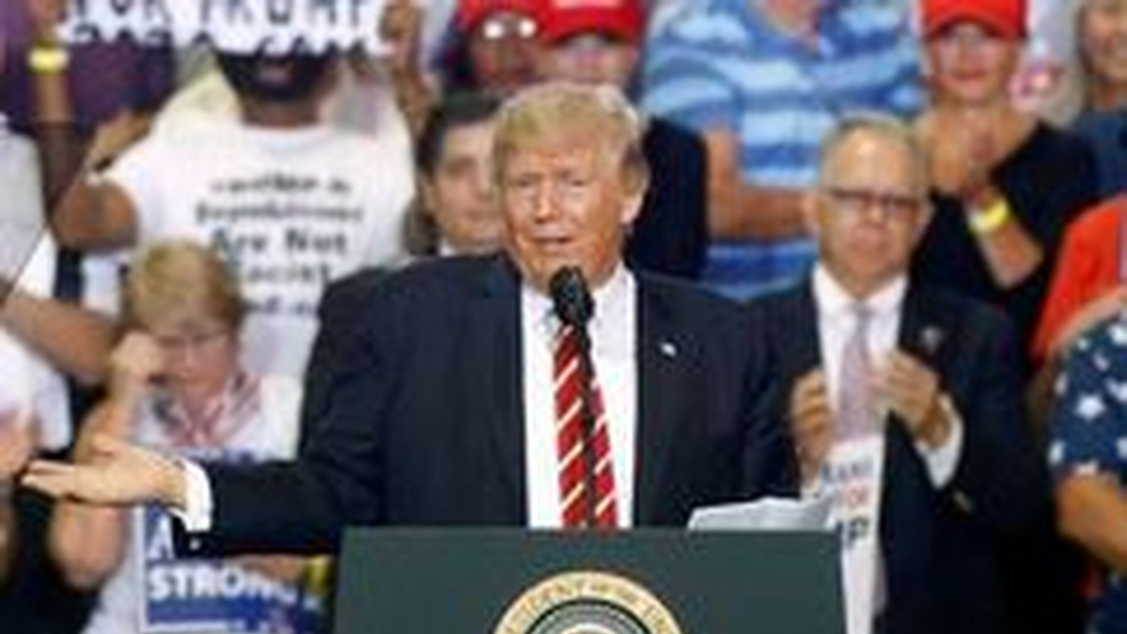 President Donald Trump gestures to the crowd as he speaks to supporters at the Phoenix Convention Center on Aug. 22, 2017. (Ralph Freso/Getty Images)