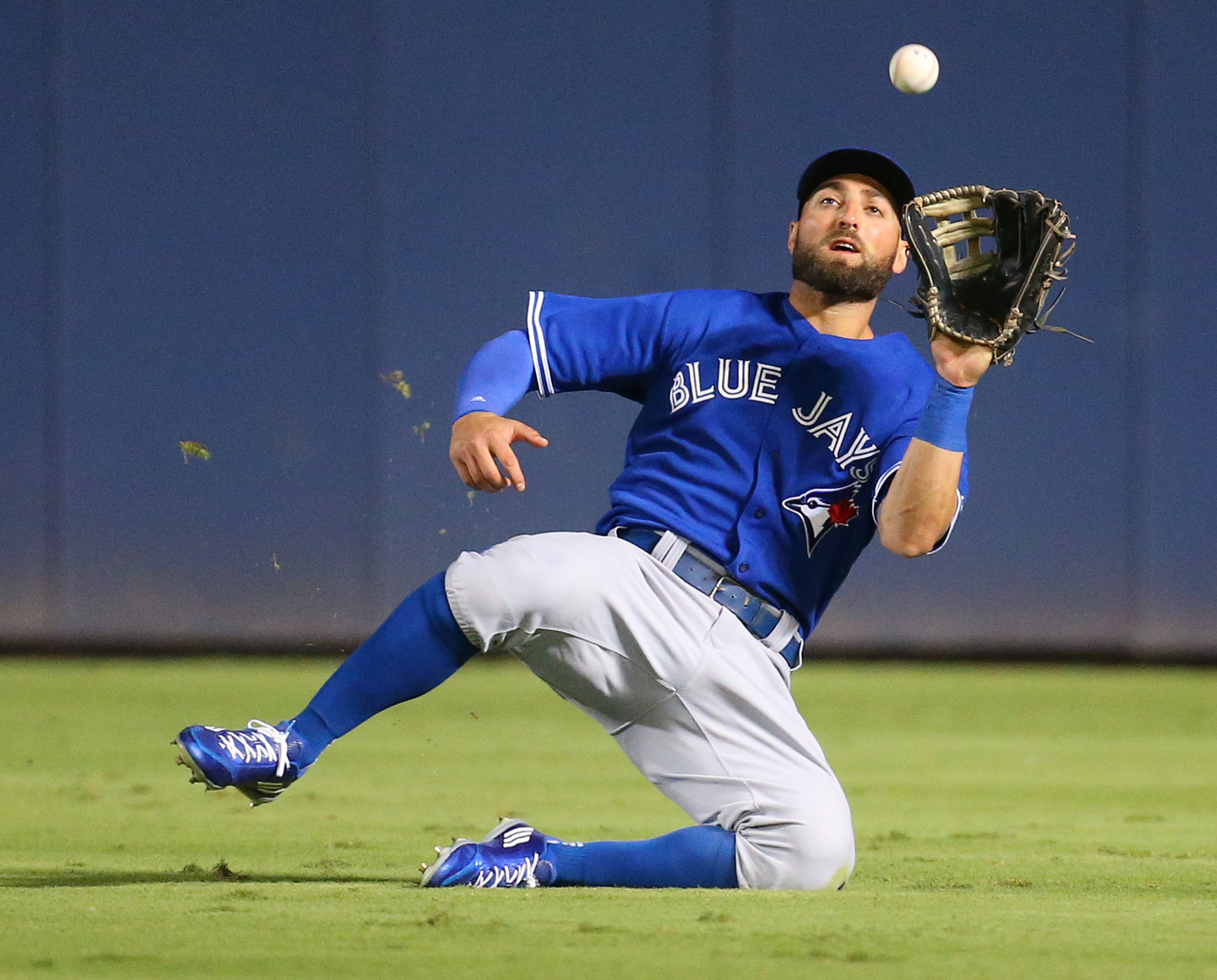 Blue Jays Kevin Pillar makes a sliding catch on a long fly ball by Braves Nick Markakis during the fifth inning in a baseball game on Tuesday, Sept. 15, 2015, in Atlanta. Curtis Compton / ccompton@ajc.com