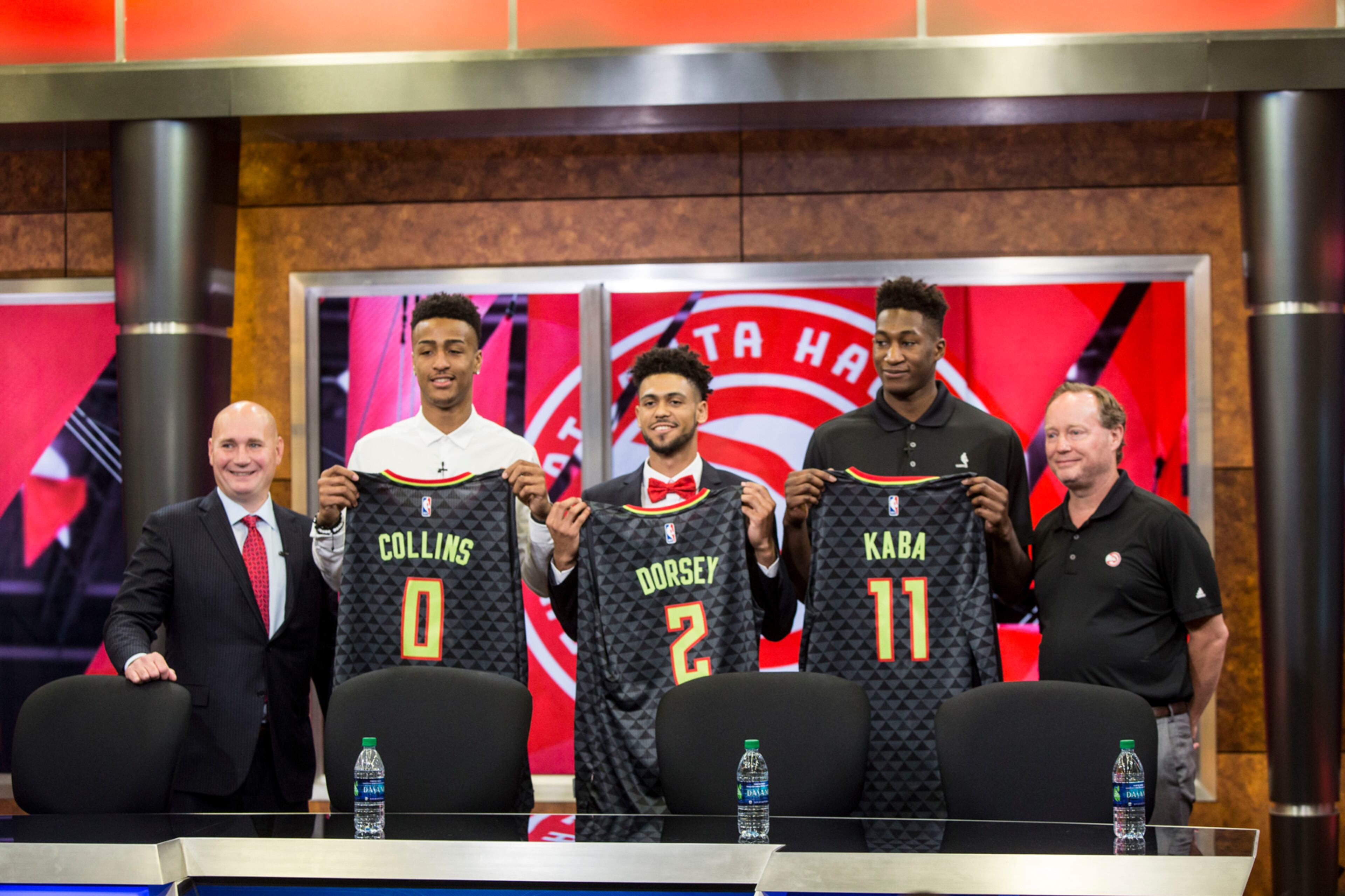 Atlanta Hawks General Manager, Travis Schlenk (far left), and Head Coach Mike Budenholzer (far right), stand on the outside of rookies: John Collins (left), Tyler Dorsey (middle) and Alpha Kaba (right). Chad Rhym/ Chad.Rhym@ajc.com