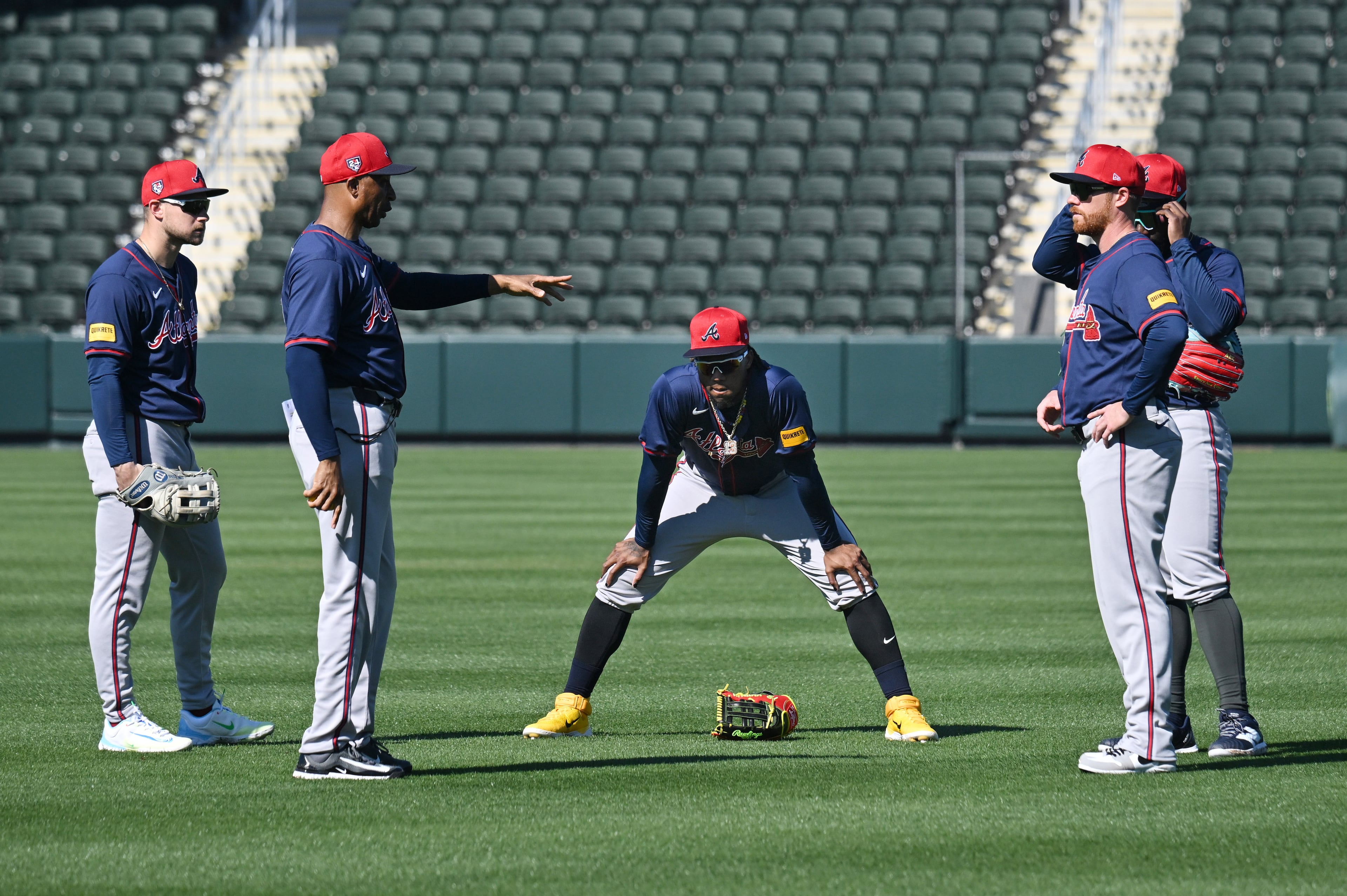 Atlanta Braves first base coach Tom Goodwin speaks to players during spring training workouts at CoolToday Park, Wednesday, Feb. 21, 2024, in North Port, Florida. (Hyosub Shin / Hyosub.Shin@ajc.com)