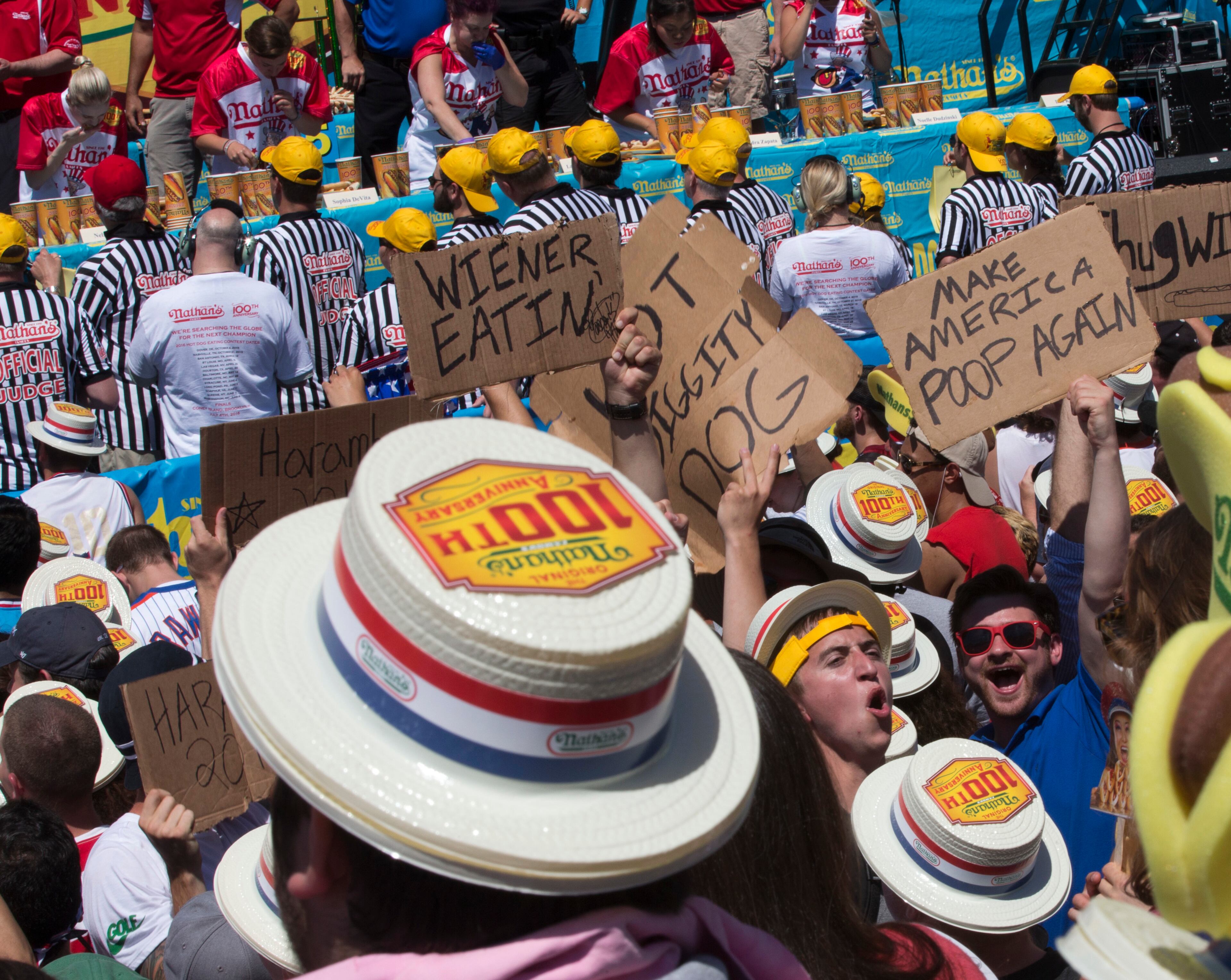 Spectators cheer as the women competitors compete in Nathan's Famous Fourth of July International Hot Dog Eating Contest, Monday, July 4, 2016, in New York. (AP Photo/Mary Altaffer)