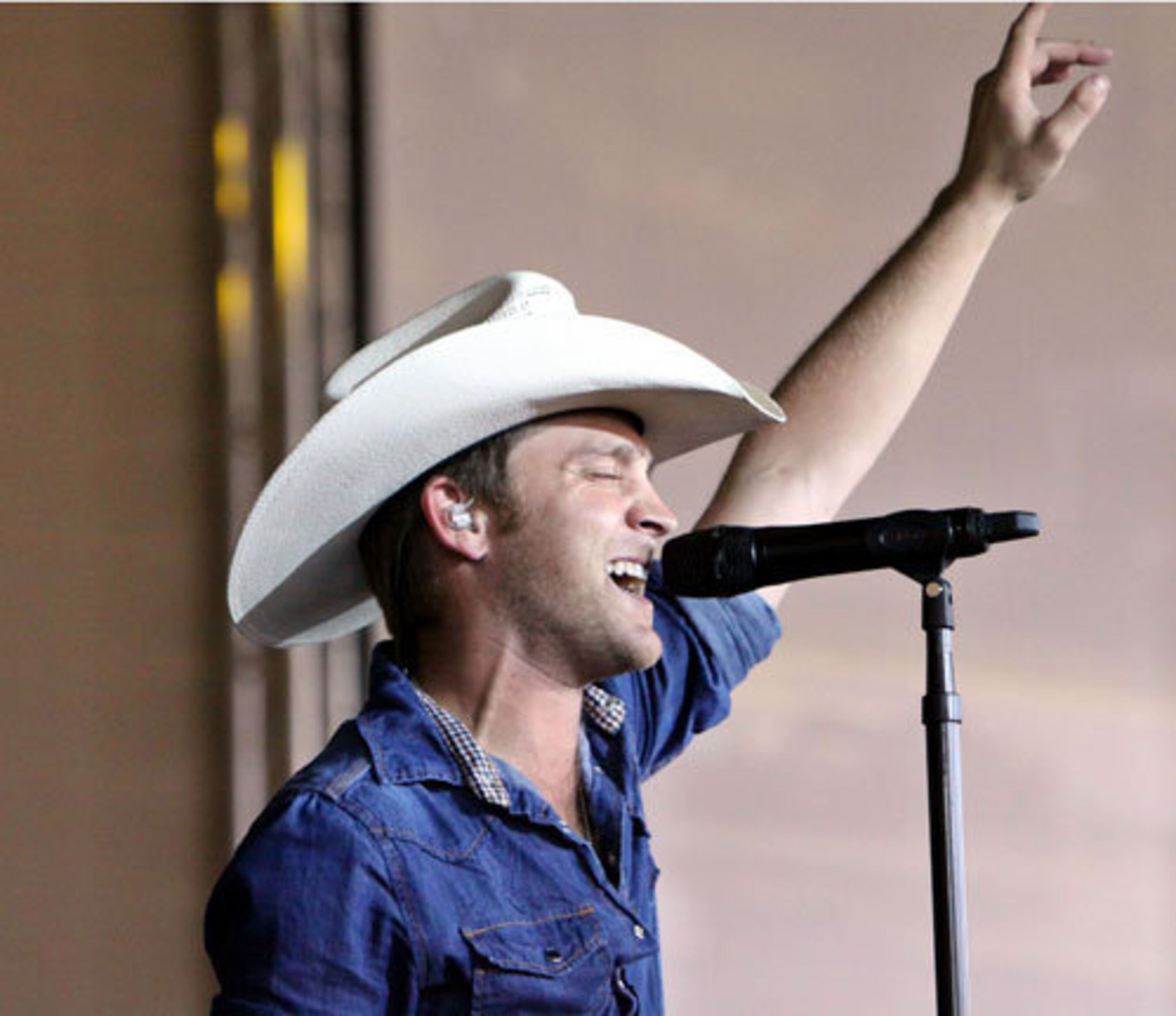 Justin Moore performs with Rascal Flatts on their Flatts Fest Tour.