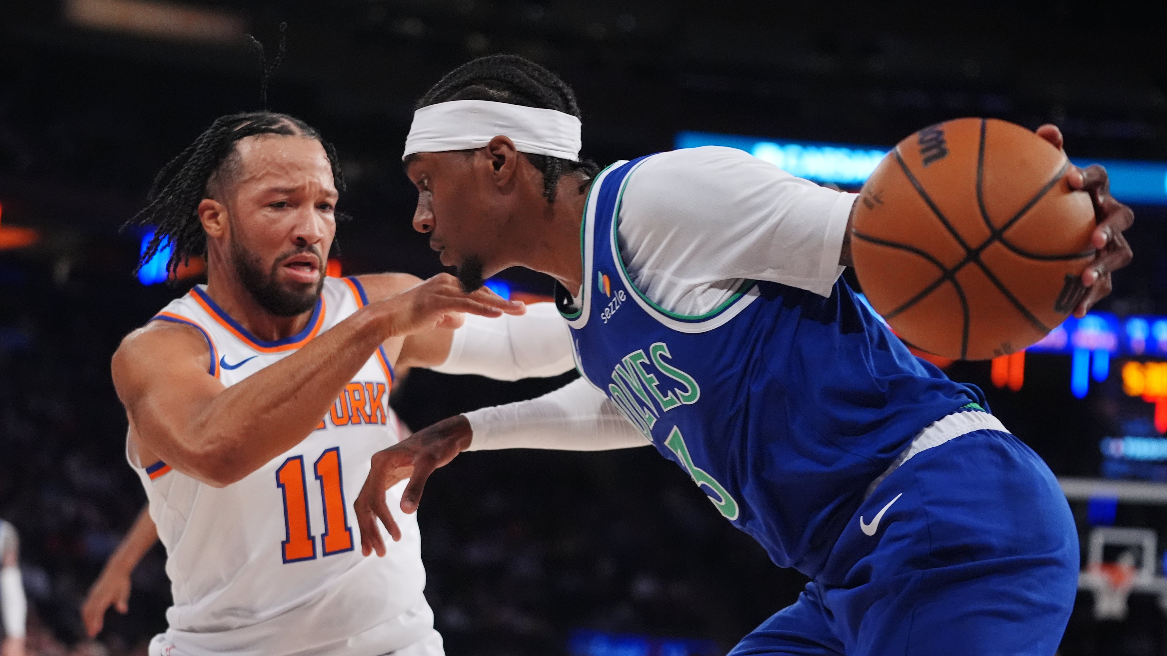 New York Knicks' Jalen Brunson (11) defends Minnesota Timberwolves' Jaden McDaniels (3) during the first half of a preseason NBA basketball game Monday, Oct. 12, 2026, in New York. (AP Photo/Frank Franklin II)