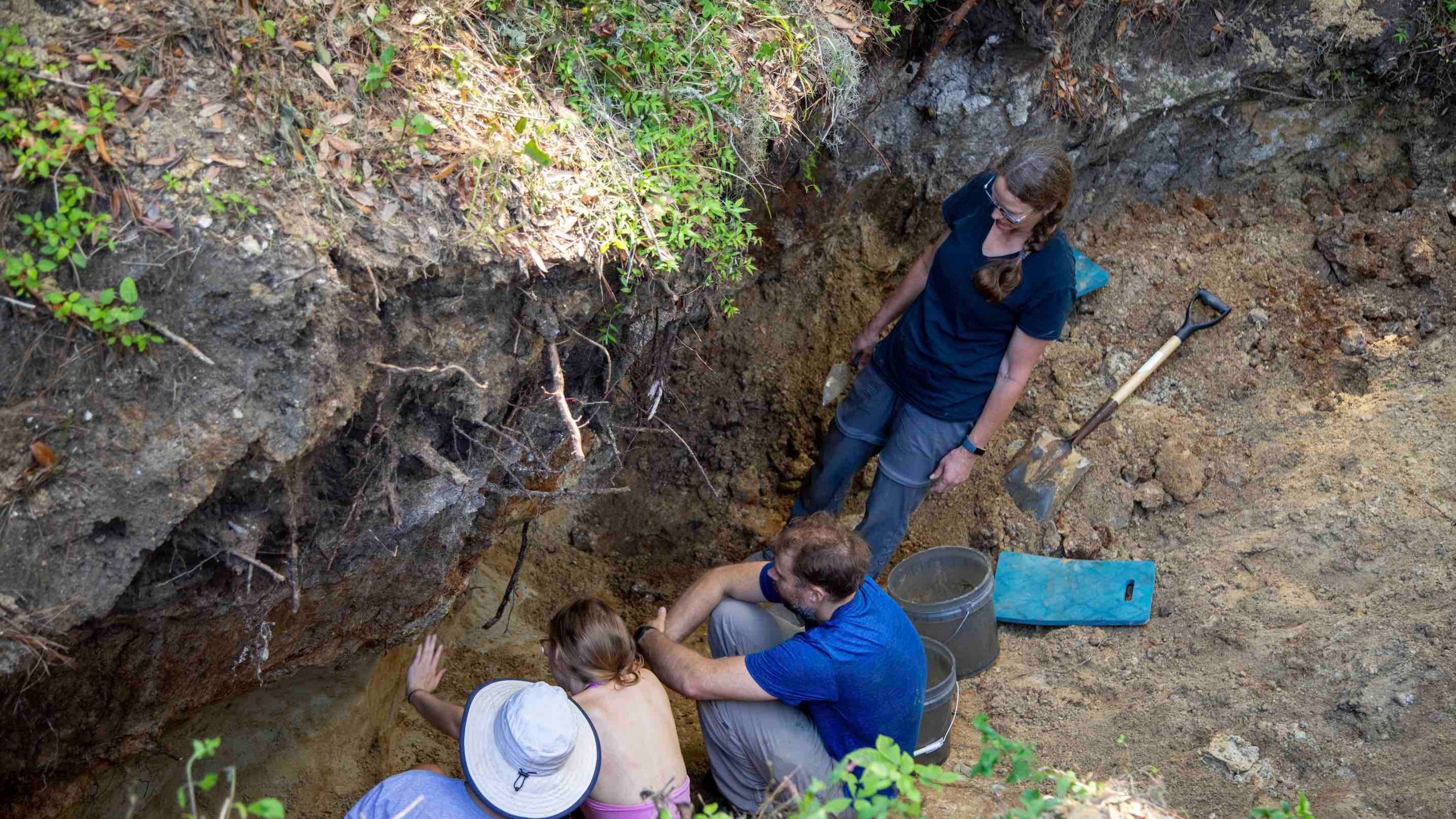 Researchers work at the dig site in coastal Georgia to unearth ancient remains.