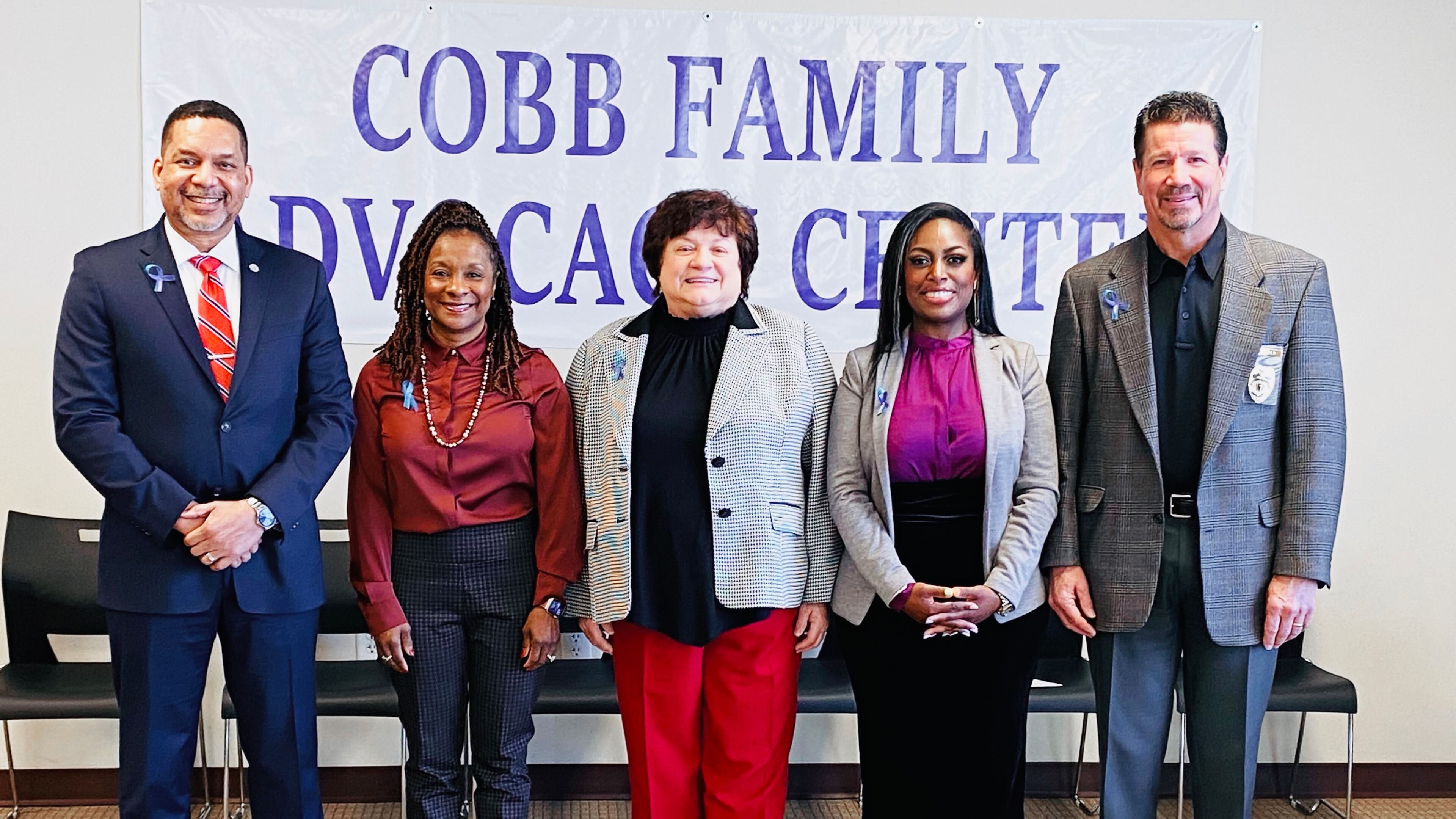 Shown left to right: Cobb County District Attorney Flynn Broady, County Manager Jackie McMorris, property management Sharon Stanley, the family advocacy center site developer Tanesha McAuley, and Public Safety Director Randy Crider gathered to dedicate the new family advocacy center on Thursday, December 15, 2022. Courtesy of Cobb County