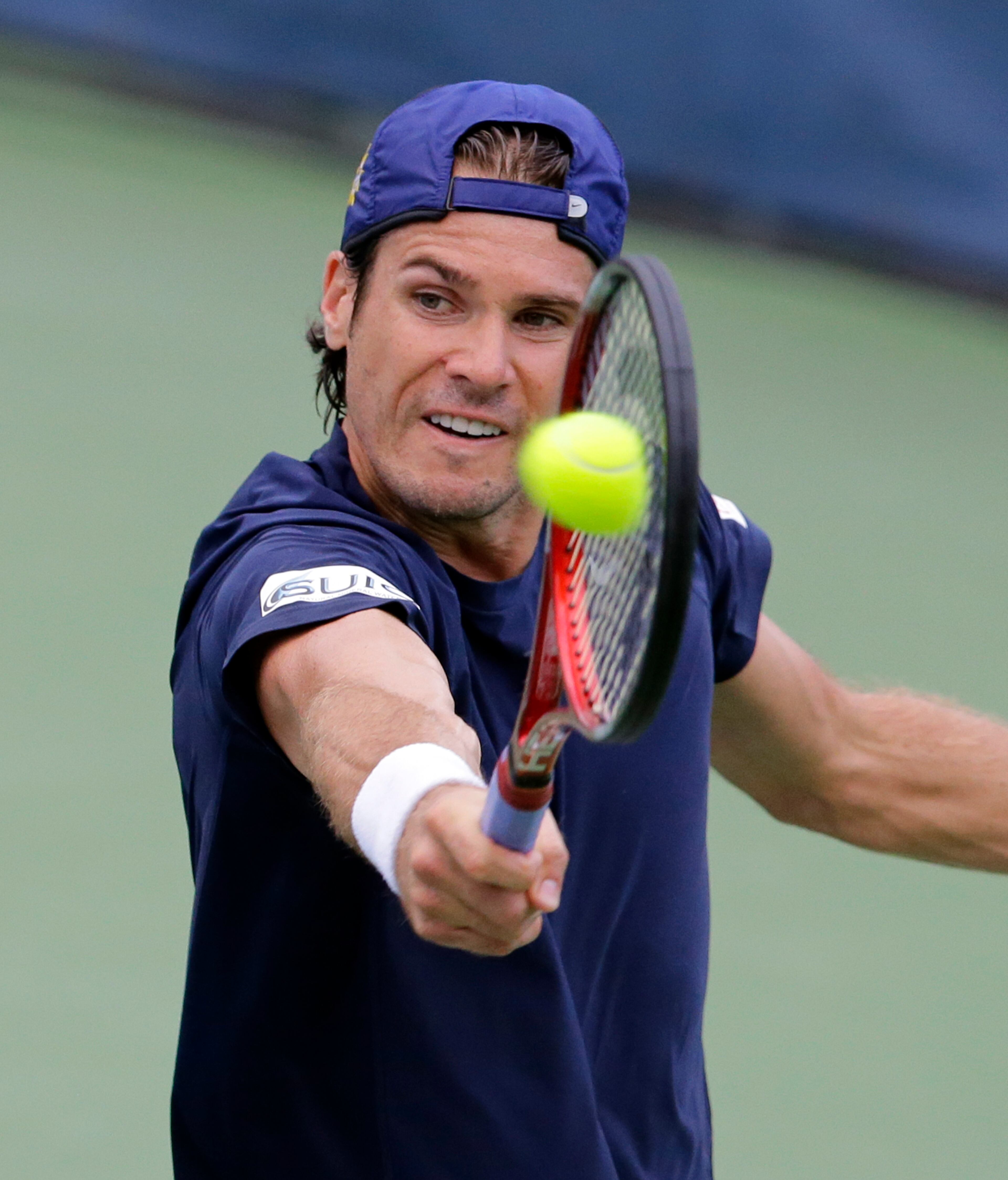Tommy Haas, from Germany, hits a return to Tim Smyczek, of the United States, at the Citi Open tennis tournament, Wednesday, July 31, 2013, in Washington. (AP Photo/Alex Brandon)