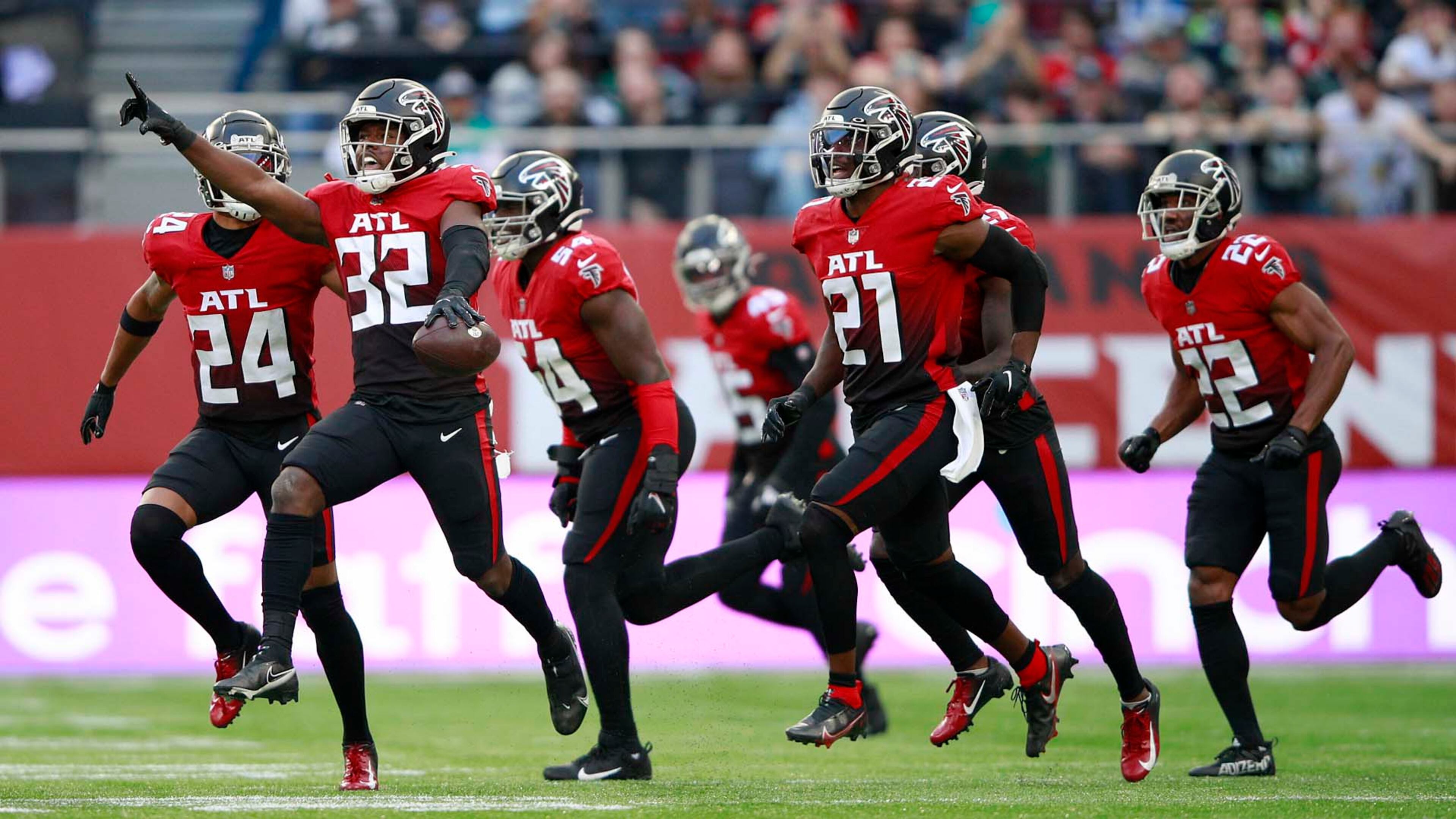 Falcons safety Jaylinn Hawkins (32) celebrates making an interception during the first half against the New York Jets Sunday, Oct. 10, 2021, at the Tottenham Hotspur stadium in London, England. (Ian Walton/AP)