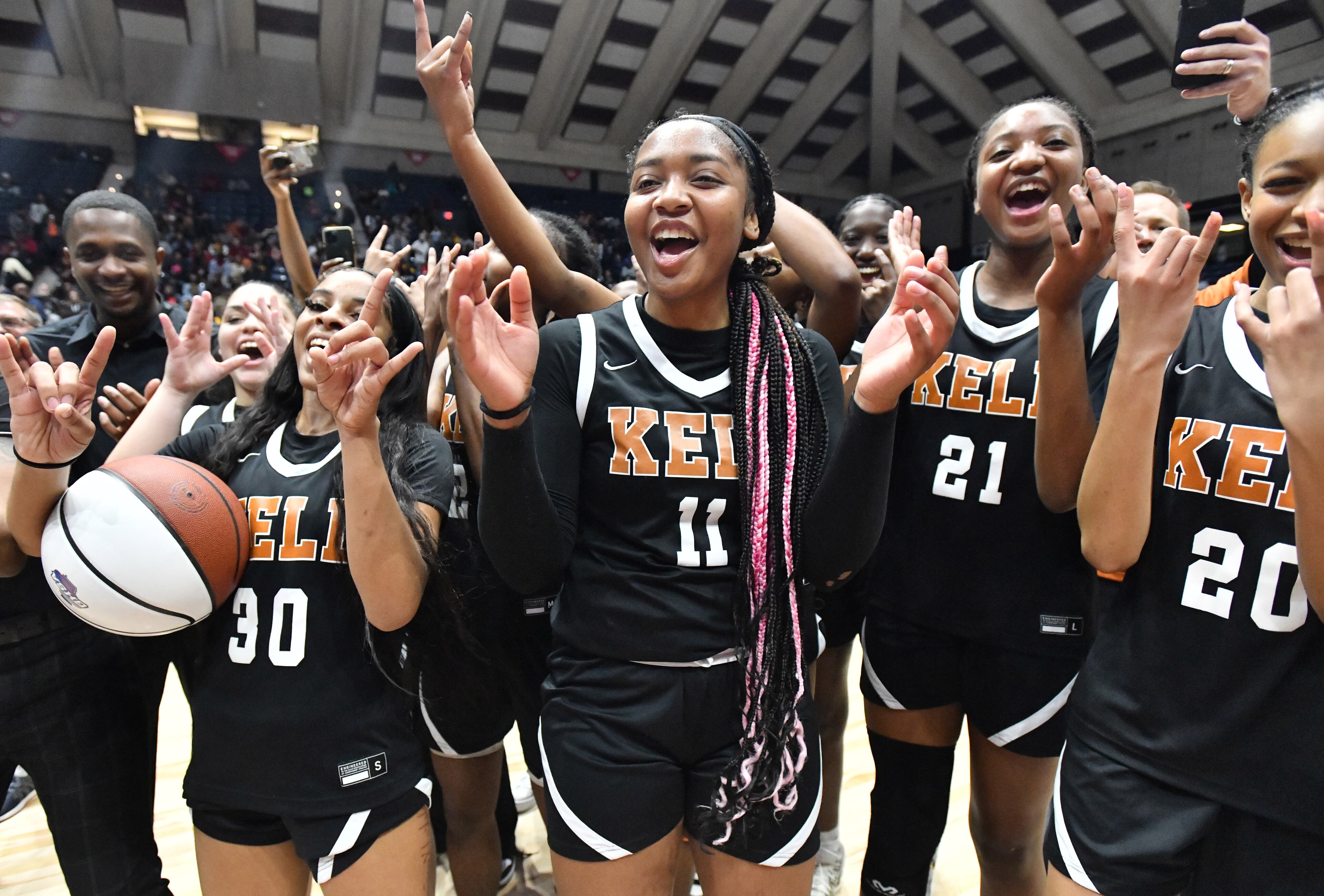 Kell players celebrate after their victory over Warner Robins Thursday in the Class 5A girls state championship game in Macon.