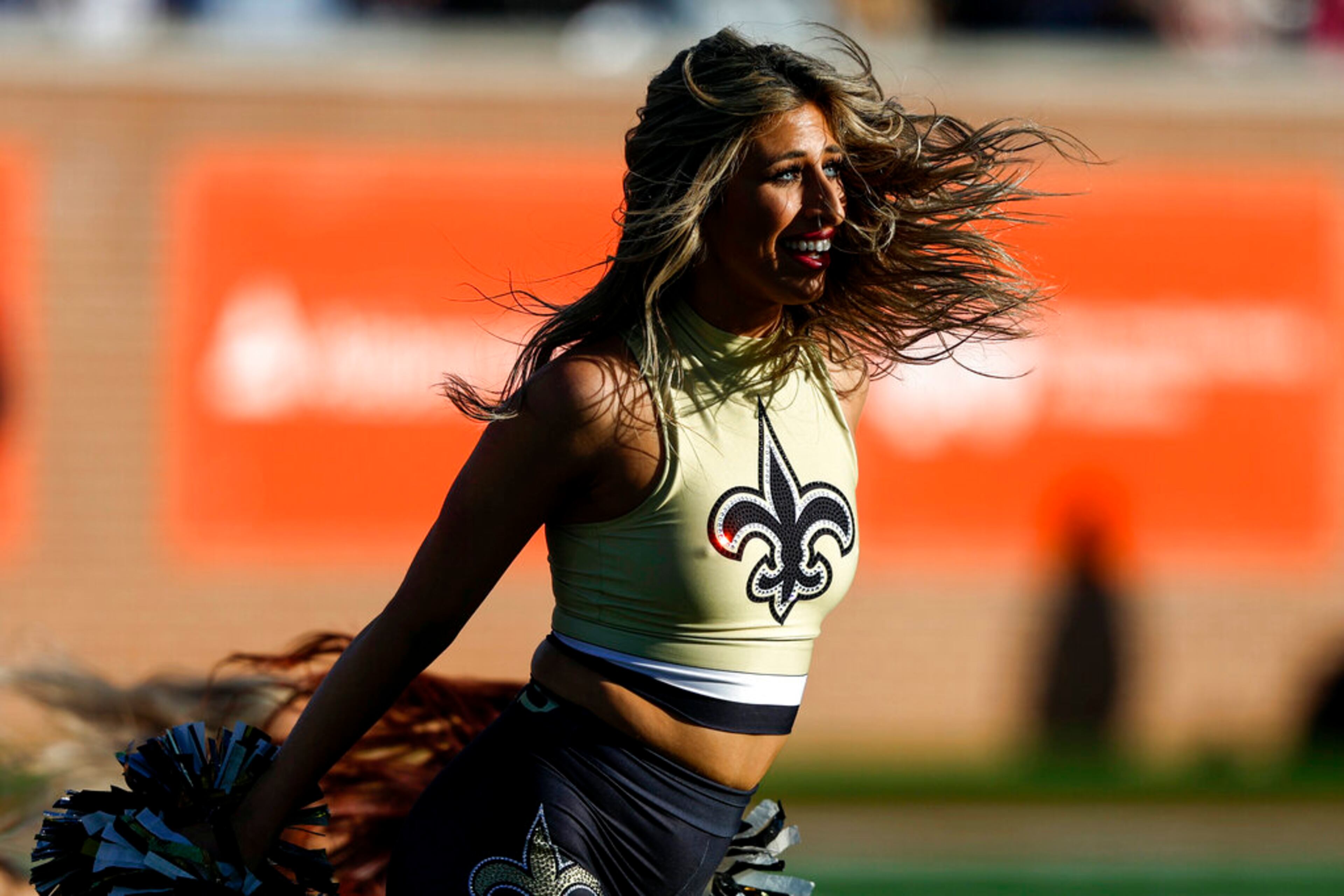 New Orleans Saints cheerleader performs during the second half of the Senior Bowl NCAA college football game, Saturday, Feb. 4, 2023, in Mobile, Ala.. (AP Photo/Butch Dill)