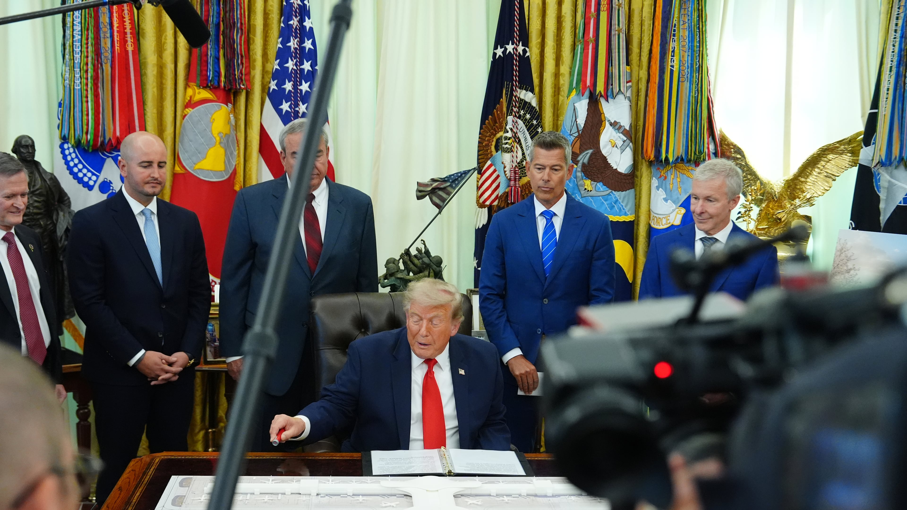 President Donald Trump speaks in the Oval Office of the White House about Dulles International Airport modernization, Wednesday, July 29, 2026, in Washington. (AP Photo/Julia Demaree Nikhinson)