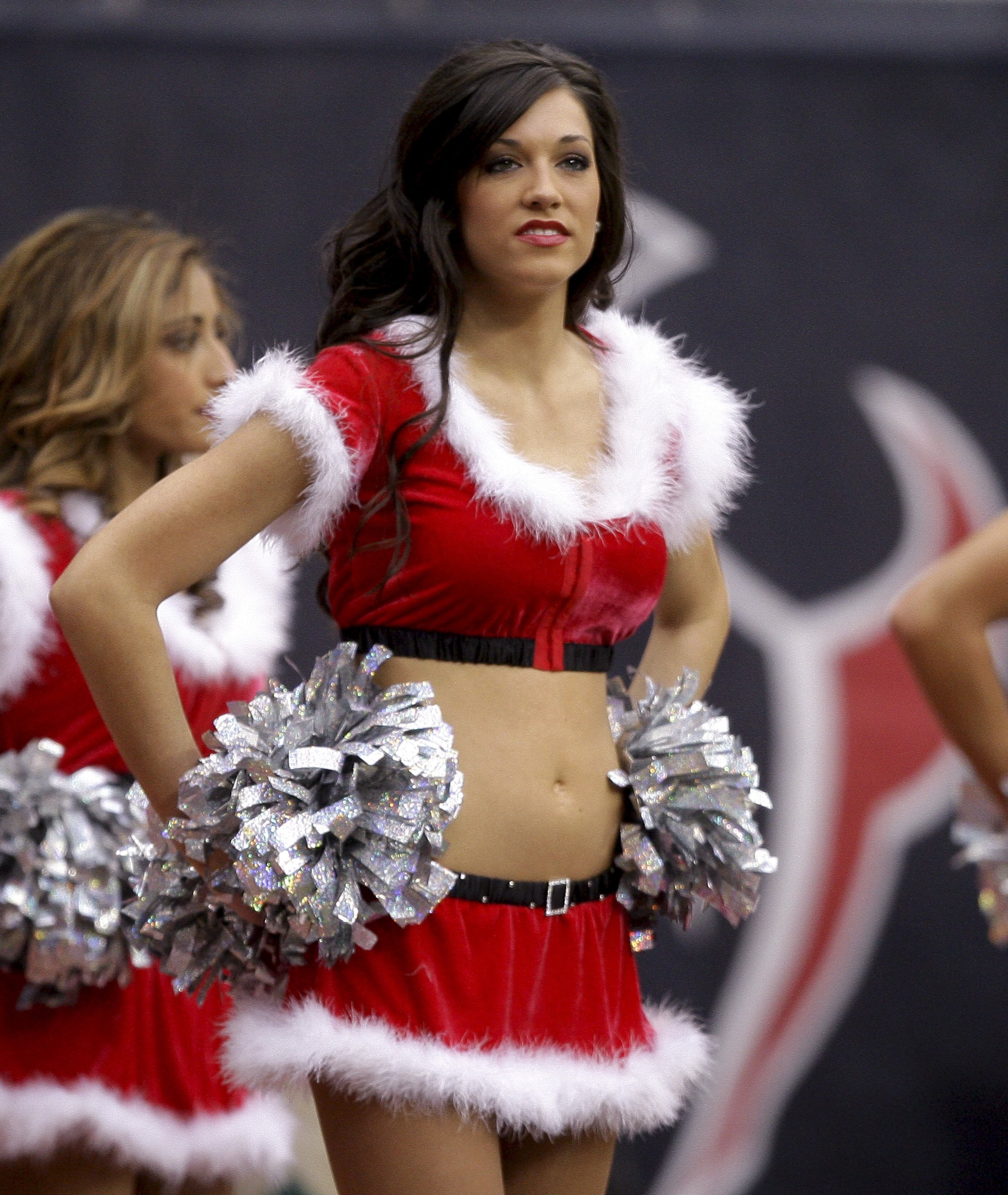 A Houston Texans cheerleader performs in a Santa Claus suit during the game against the Seattle Seahawks at Reliant Stadium on Dec. 13, 2009 in Houston.
