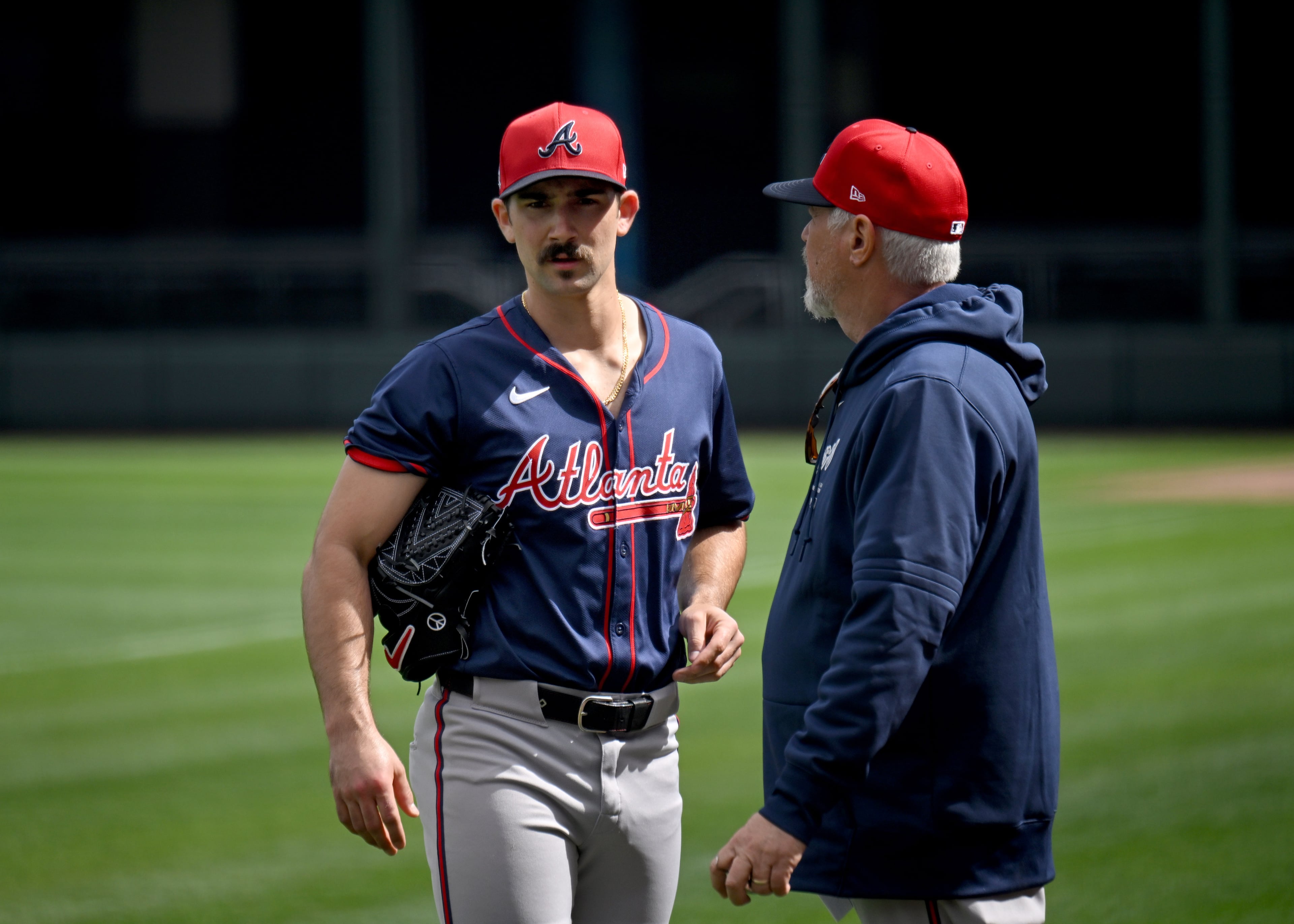 Atlanta Braves starting pitcher Spencer Strider confers with pitching coach Rick Kranitz after throwing live batting practice at CoolToday Park, Monday, Feb. 19, 2024, in North Port, Florida. (Hyosub Shin / Hyosub.Shin@ajc.com)