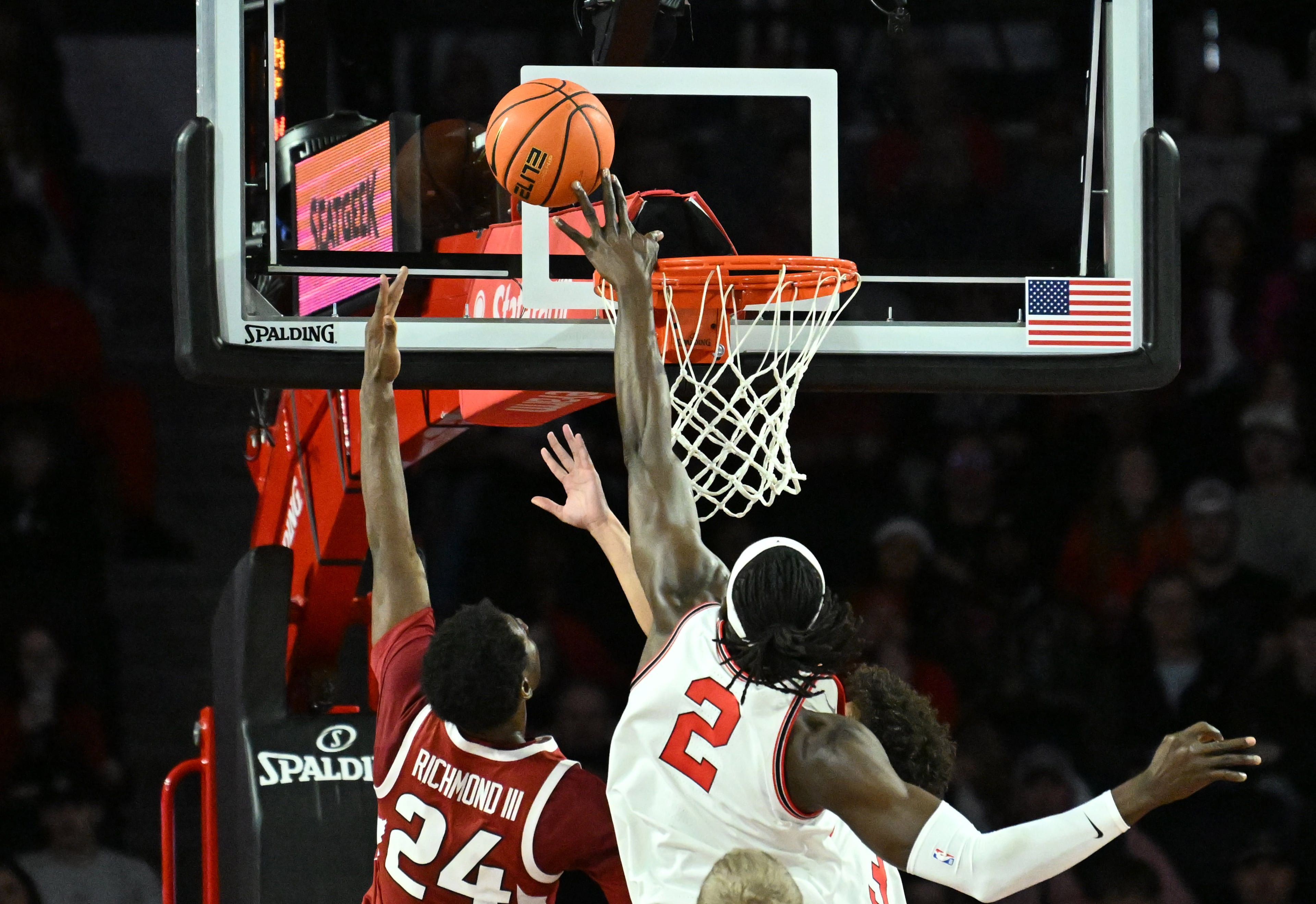Georgia center Somto Cyril (right) blocks the shot by Arkansas forward Billy Richmond III (left) during the first half in an NCAA college basketball game at Stegeman Coliseum, Saturday, Jan. 17, 2026, in Athens. (Hyosub Shin/AJC)