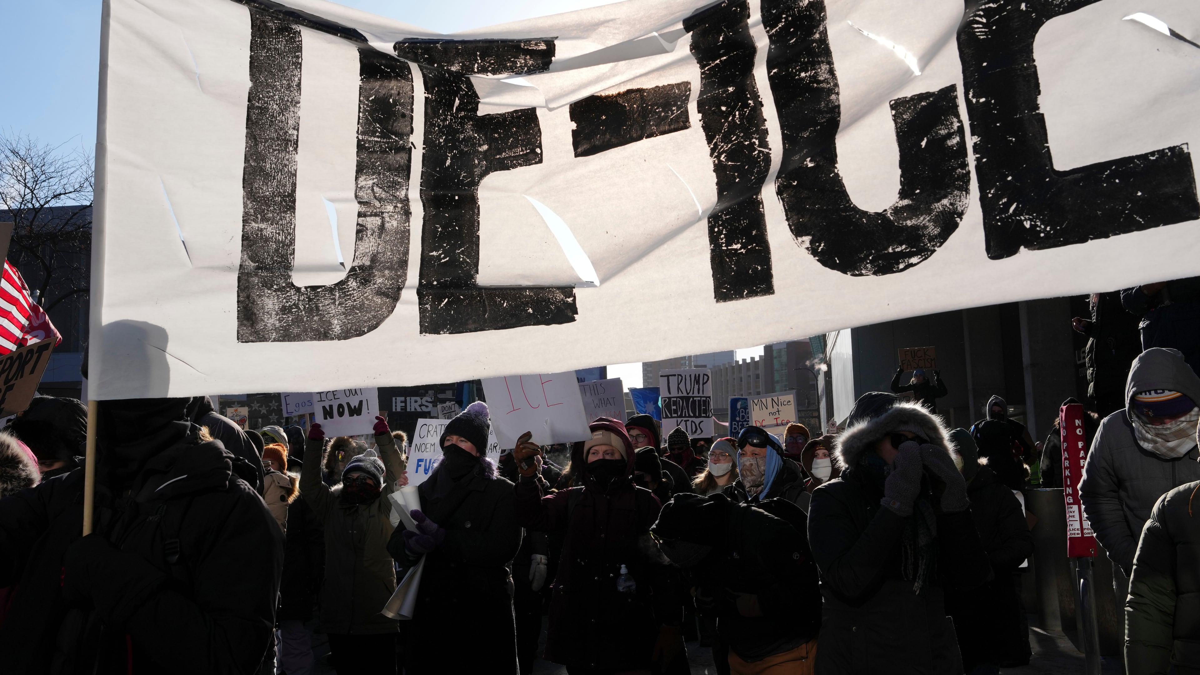 People protest against ICE (Immigration and Customs Enforcement) in Minneapolis, Sunday, Jan. 25, 2026. (AP Photo/Adam Gray)