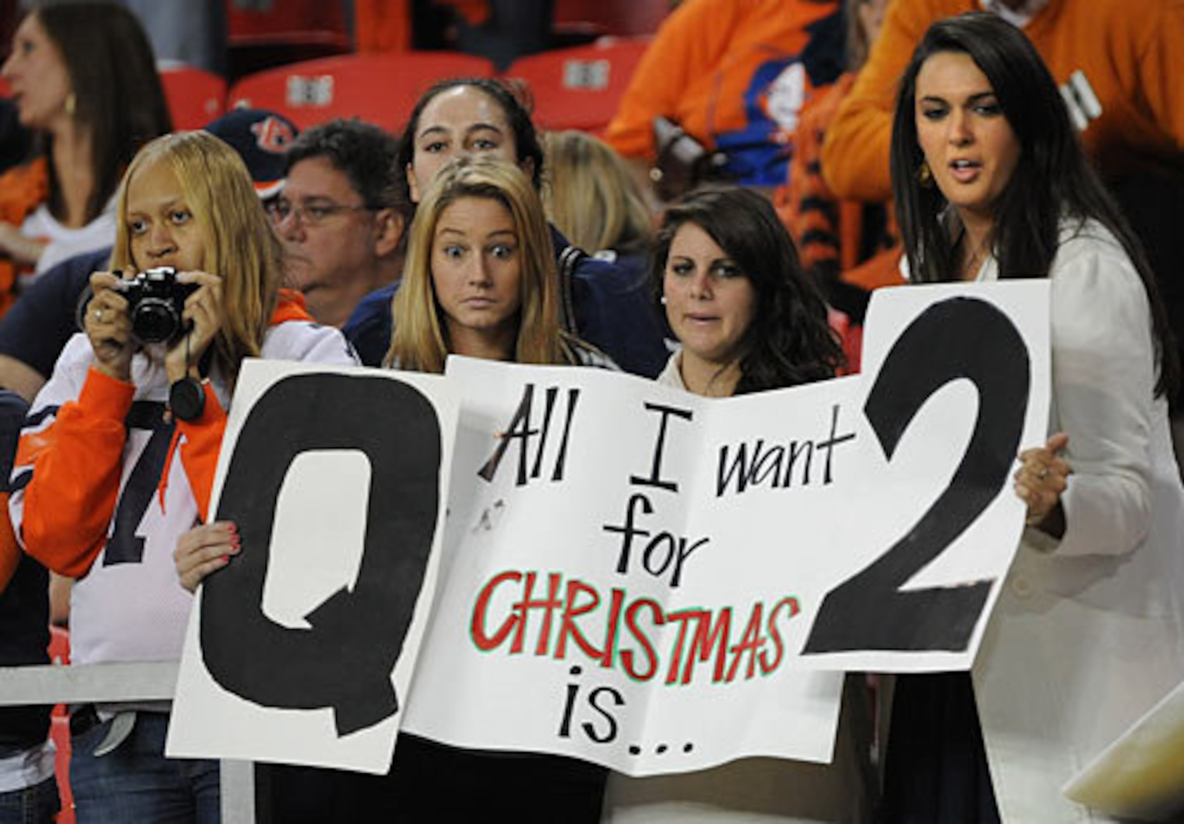 Auburn fans hold up signs supporting Auburn quarterback Cam Newton before the SEC Championship game.