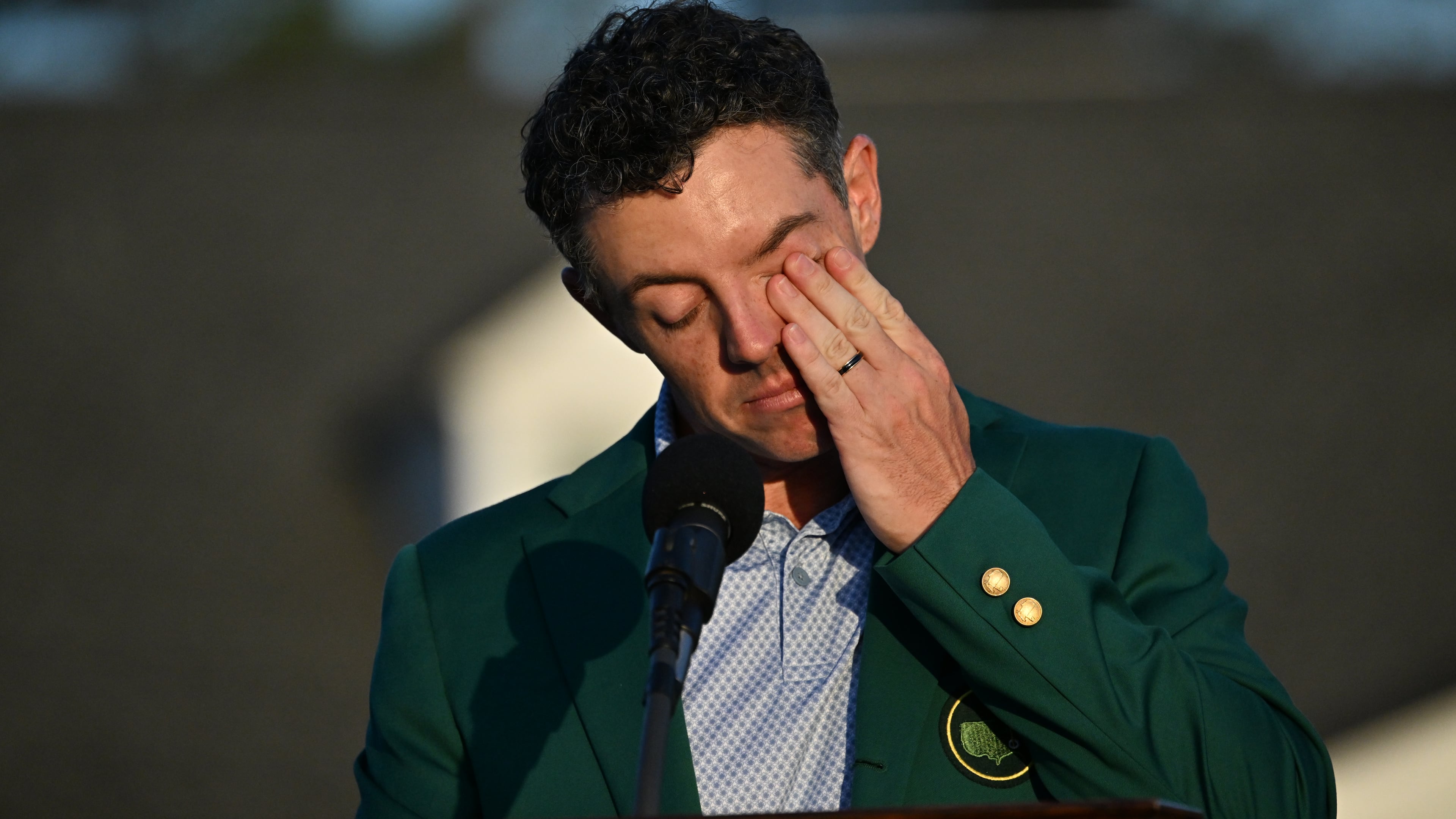 Masters champion Rory McIlroy wipes away a tear at the Green Jacket Ceremony at Augusta National Golf Club on April 12, 2026 in Augusta, Ga. (Hyosub Shin/AJC)