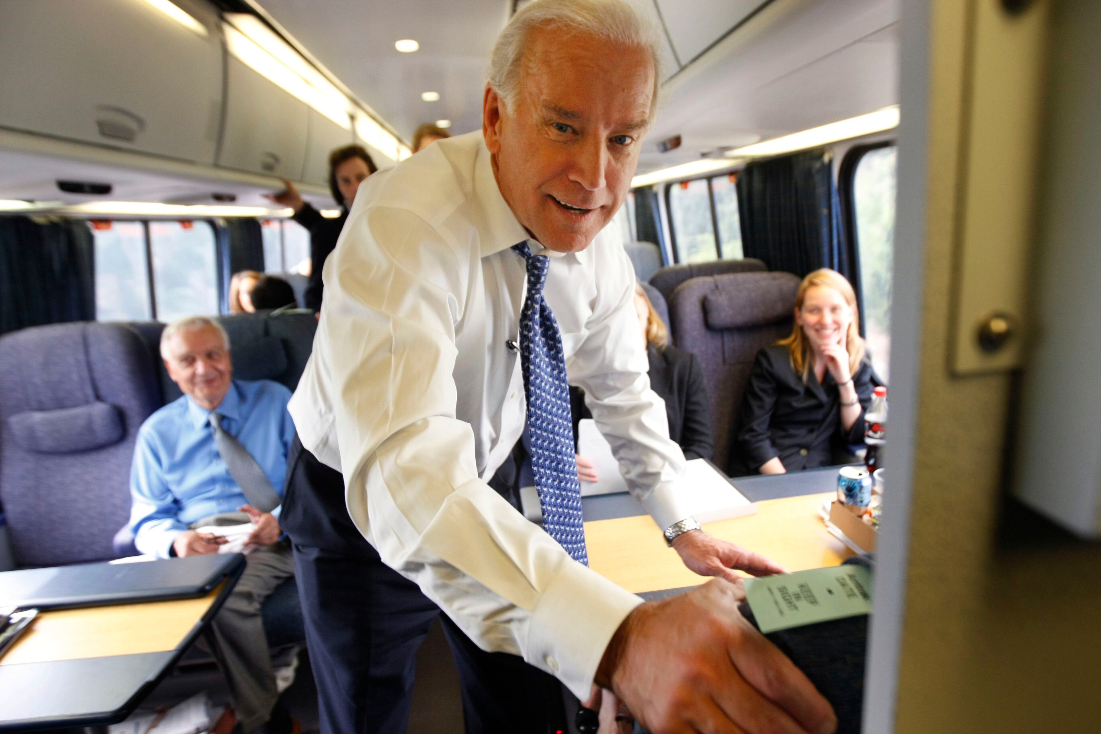 Democratic vice presidential candidate Sen. Joe Biden, D-Del. mingles with passengers on his way to the cafe car aboard the Amtrak Acela train from Washington to Wilmington, Del., Tuesday, Sept. 16, 2008. (AP Photo/Gerald Herbert)