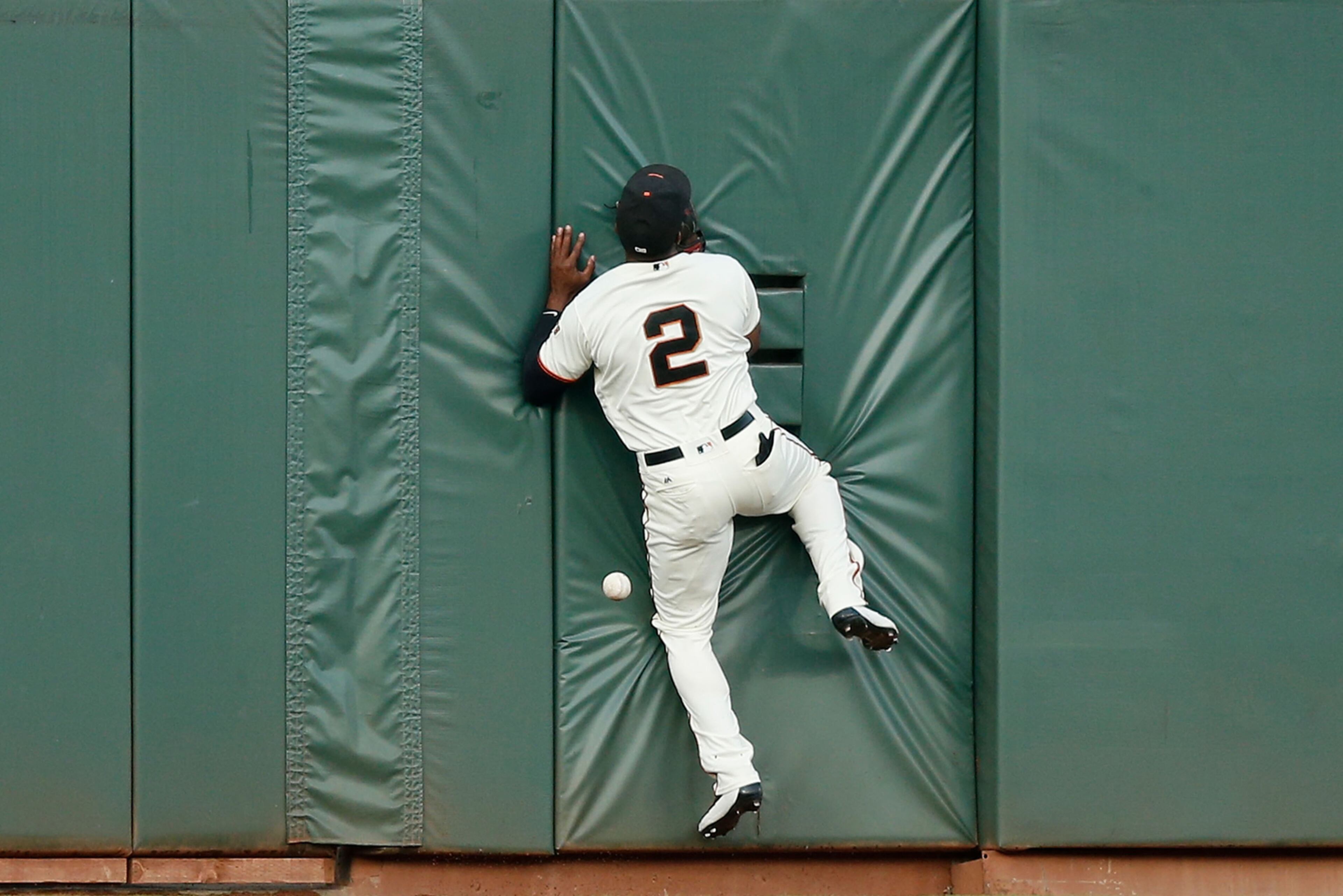 SAN FRANCISCO, CA - AUGUST 02: Denard Span #2 of the San Francisco Giants is unable to catch a fly ball hit by Matt Chapman #26 of the Oakland Athletics in the second inning of an interleague game at AT&T Park on August 2, 2017 in San Francisco, California. (Photo by Lachlan Cunningham/Getty Images)
