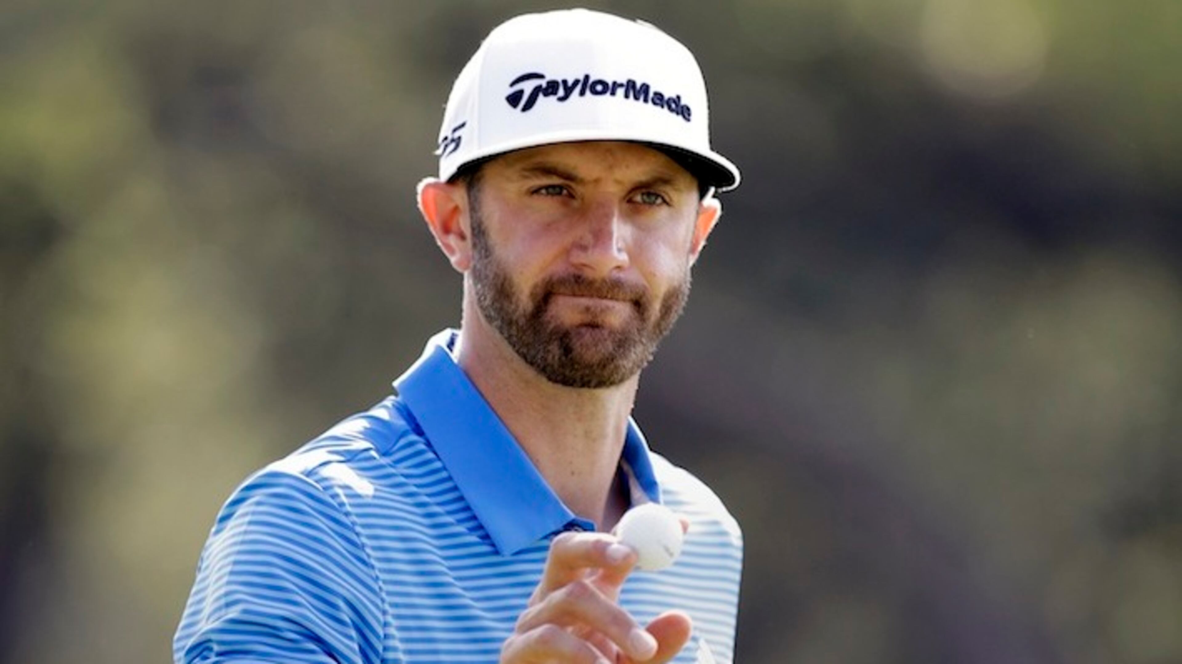 Dustin Johnson waves to the gallery after a birdie putt on the sixth hole during semifinal play at the Dell Technologies Match Play golf tournament at Austin County Club, Sunday, March 26, 2017, in Austin, Texas. (AP Photo/Eric Gay)