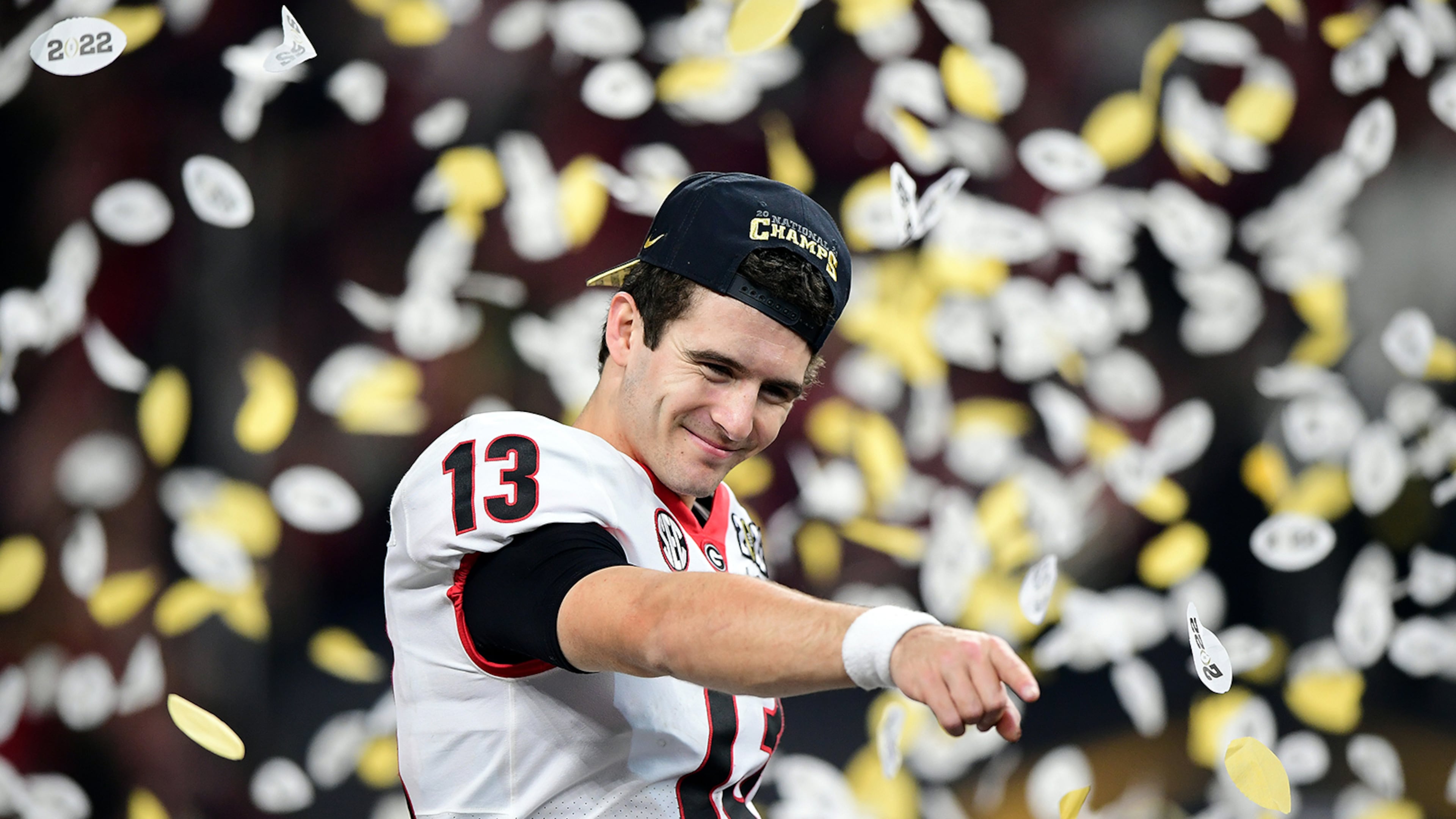 Stetson Bennett #13 of the Georgia Bulldogs celebrates after the Georgia Bulldogs defeated the Alabama Crimson Tide 33-18 during the 2022 CFP National Championship Game at Lucas Oil Stadium on Jan. 10, 2022, in Indianapolis, Indiana. (Emilee Chinn/Getty Images/TNS)