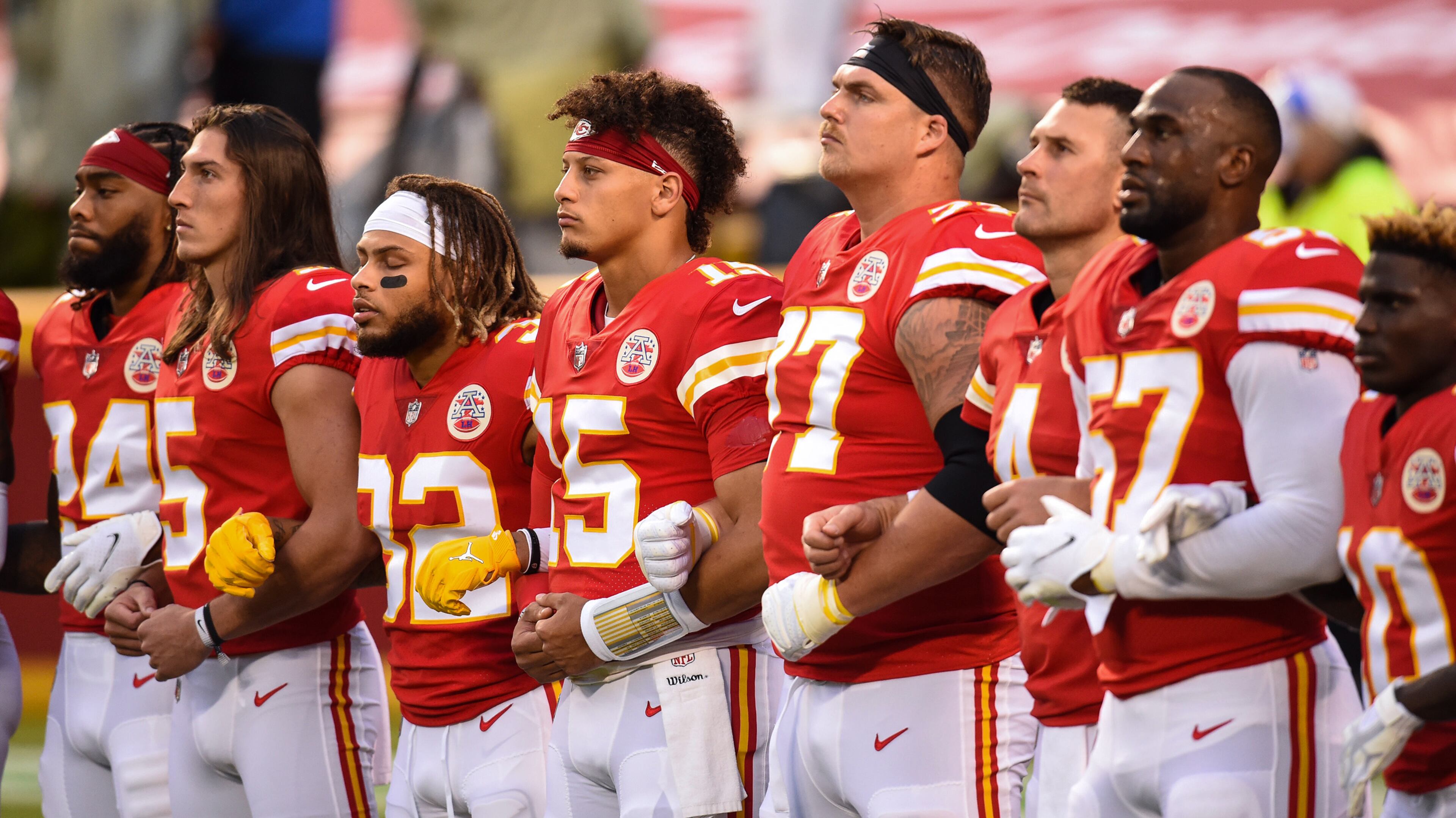 Members of the Kansas City Chiefs lock arms and stand for the playing of "Lift Every Voice and Sing", a song considered by many as the Black national anthem, during pregame ceremonies Thursday, September 10, 2020 before the Chiefs took on the Houston Texans in the NFL season opener at Arrowhead Stadium in Kansas City, Missouri. (Tammy Ljungblad/The Kansas City Star/TNS)