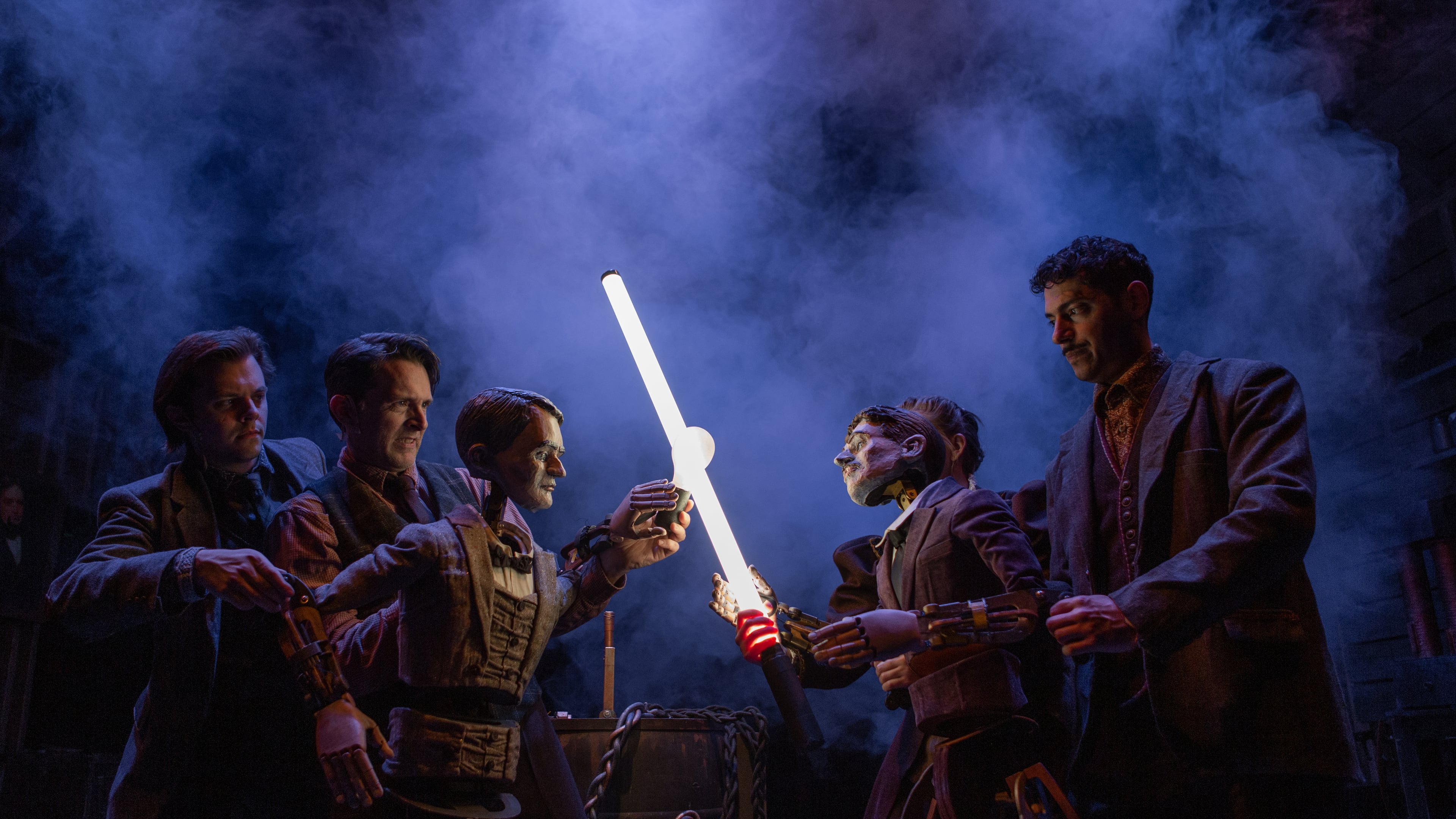 Thomas Edison, puppeteered by Alex Burnette, left, and Jason Hines in 2023, clashes with Nikola Tesla, puppeteered by Sarah Beth Hester, background, and Yankl (Jake) Krakovsky, at Niagara Falls. Performances run through Aug. 23. (Photo courtesy Center for Puppetry Arts/Stacey Bode)