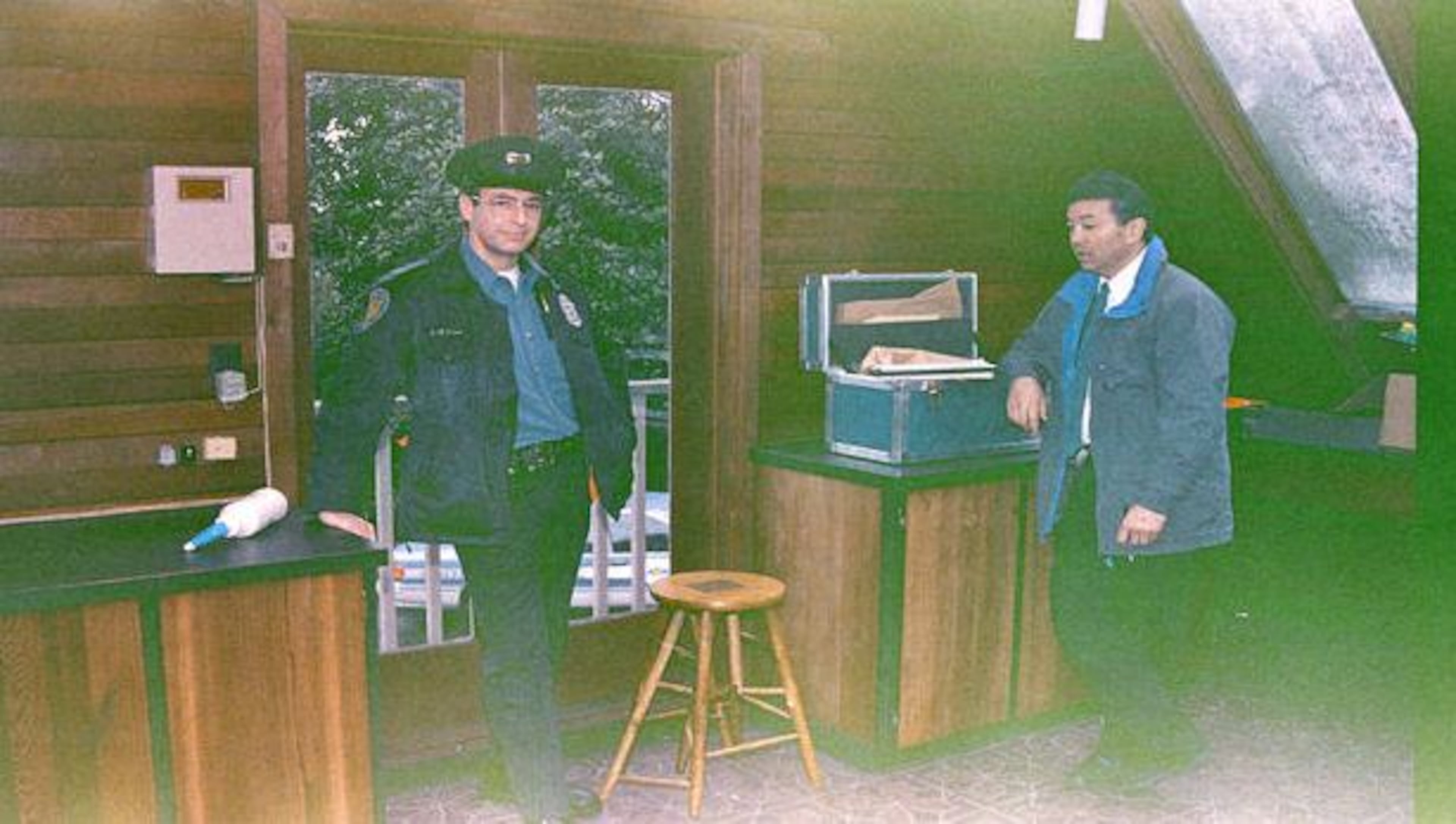 Photos of detectives looking over the scene at Cobain's home in Seattle, Washington.