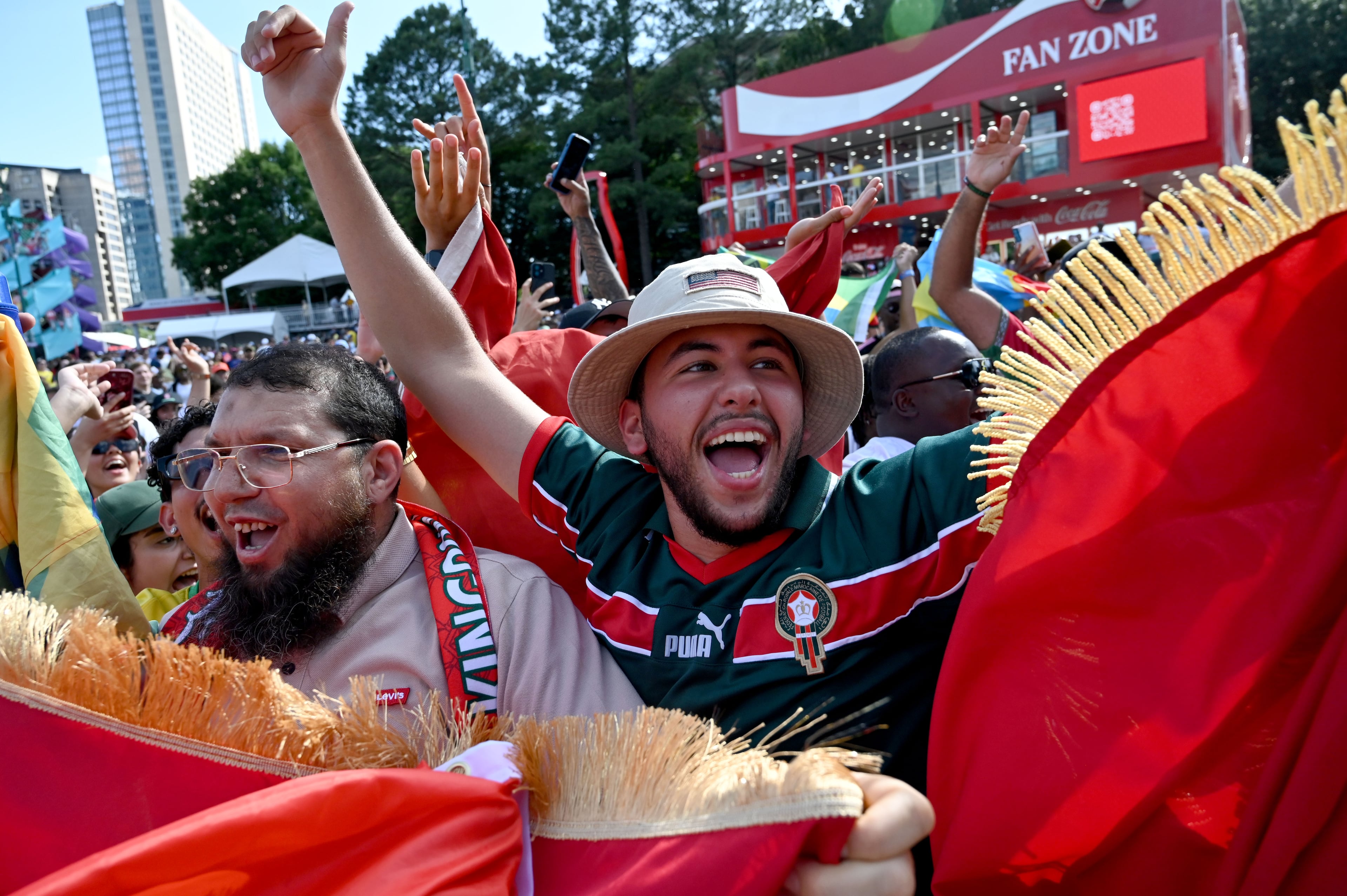 Local Moroccan fans cheer as they gather for a watch party ahead of the match against Brazil at the FIFA Fan Festival in Centennial Olympic Park on Saturday, June 13, 2026, in Atlanta. (Hyosub Shin/AJC)