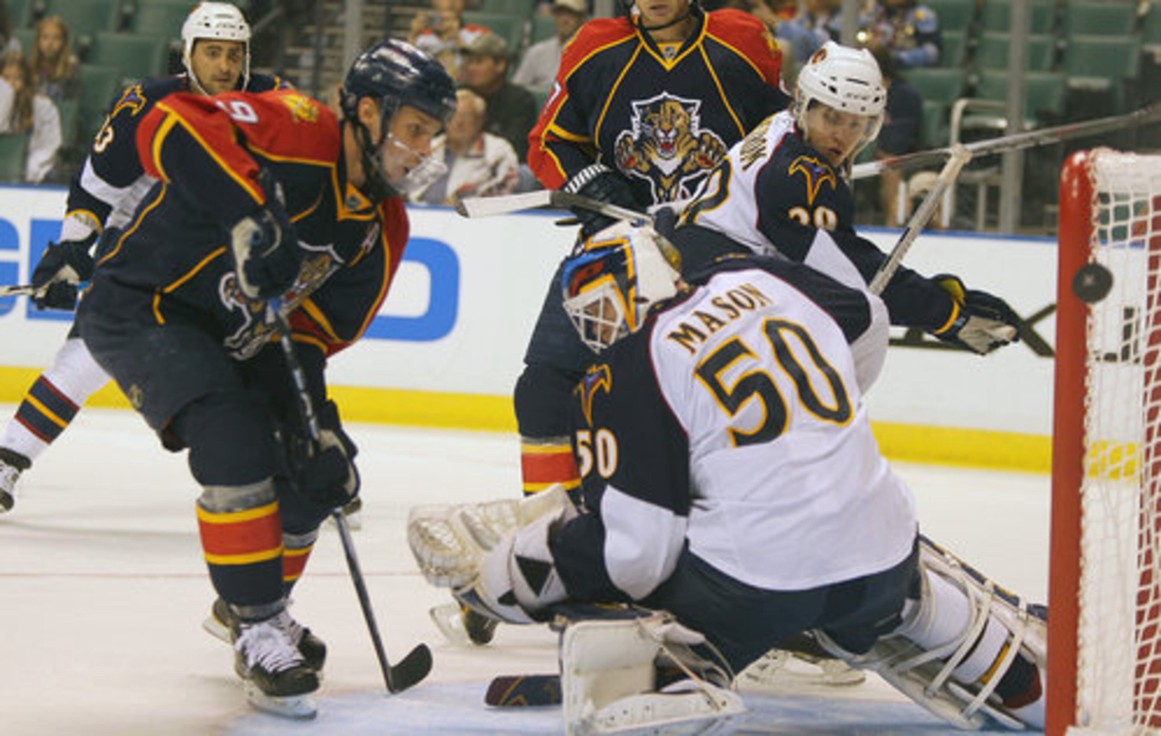 The Florida Panthers' Stephen Weiss, left, has his shot rejected by Atlanta Thrashers goalie Chris Mason (50) in the first period at Bank Atlantic Center in Sunrise, Florida, on Wednesday, November 3, 2010. Atlanta defeated the Panthers, 4-3, despite Florida putting 55 shots on Mason.