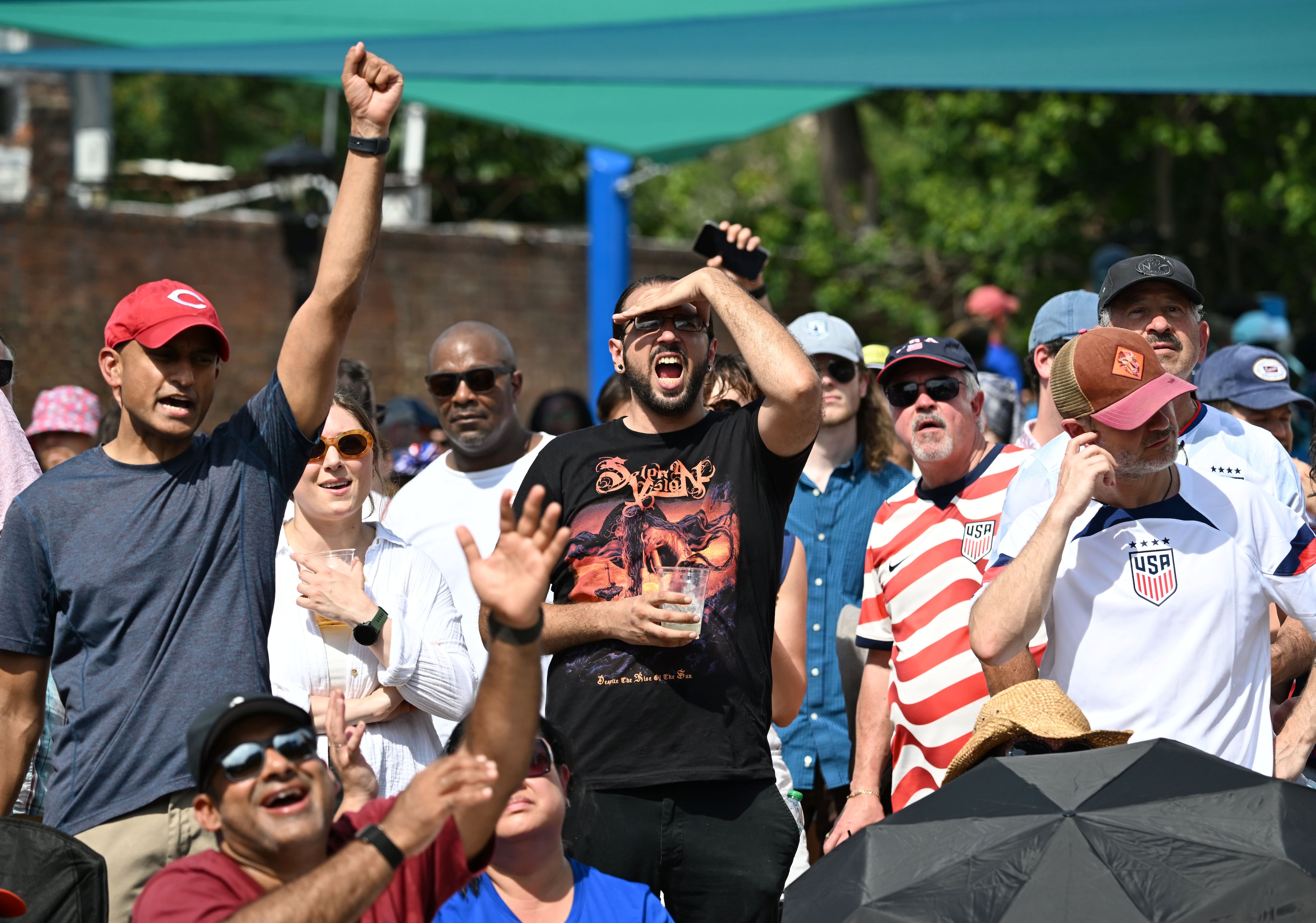 USA soccer fans react as they watch the USA vs. Australia game on a screen during Decatur WatchFest at Decatur Square on Friday, June 19, 2026. (Hyosub Shin/AJC)