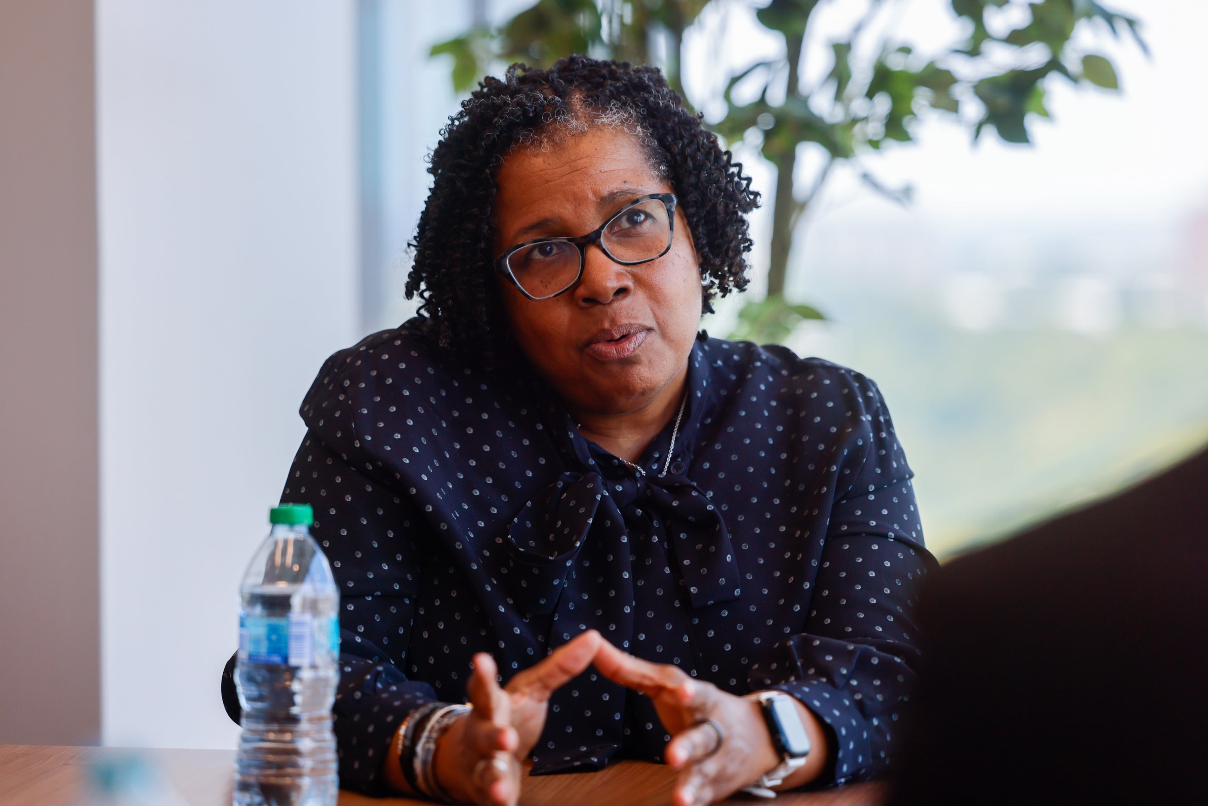 EY Atlanta Office Managing Partner Regenia Sanders speaks to an AJC reporter before a tour of EY’s new offices at Ten Twenty Spring in Atlanta on Aug. 26, 2026. (Arvin Temkar/AJC)