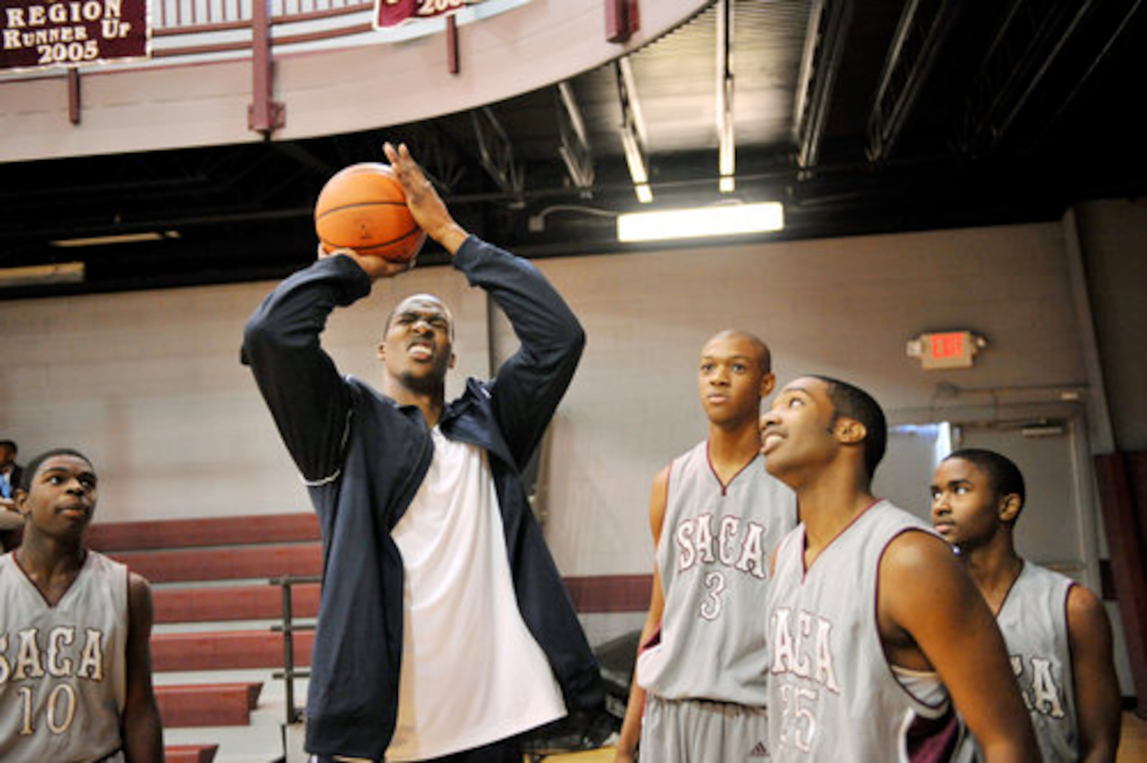 Howard takes one last shot for the boys varsity basketball team during a shooting competition between the boys and girls varsity teams. Howard didn't make the shot.