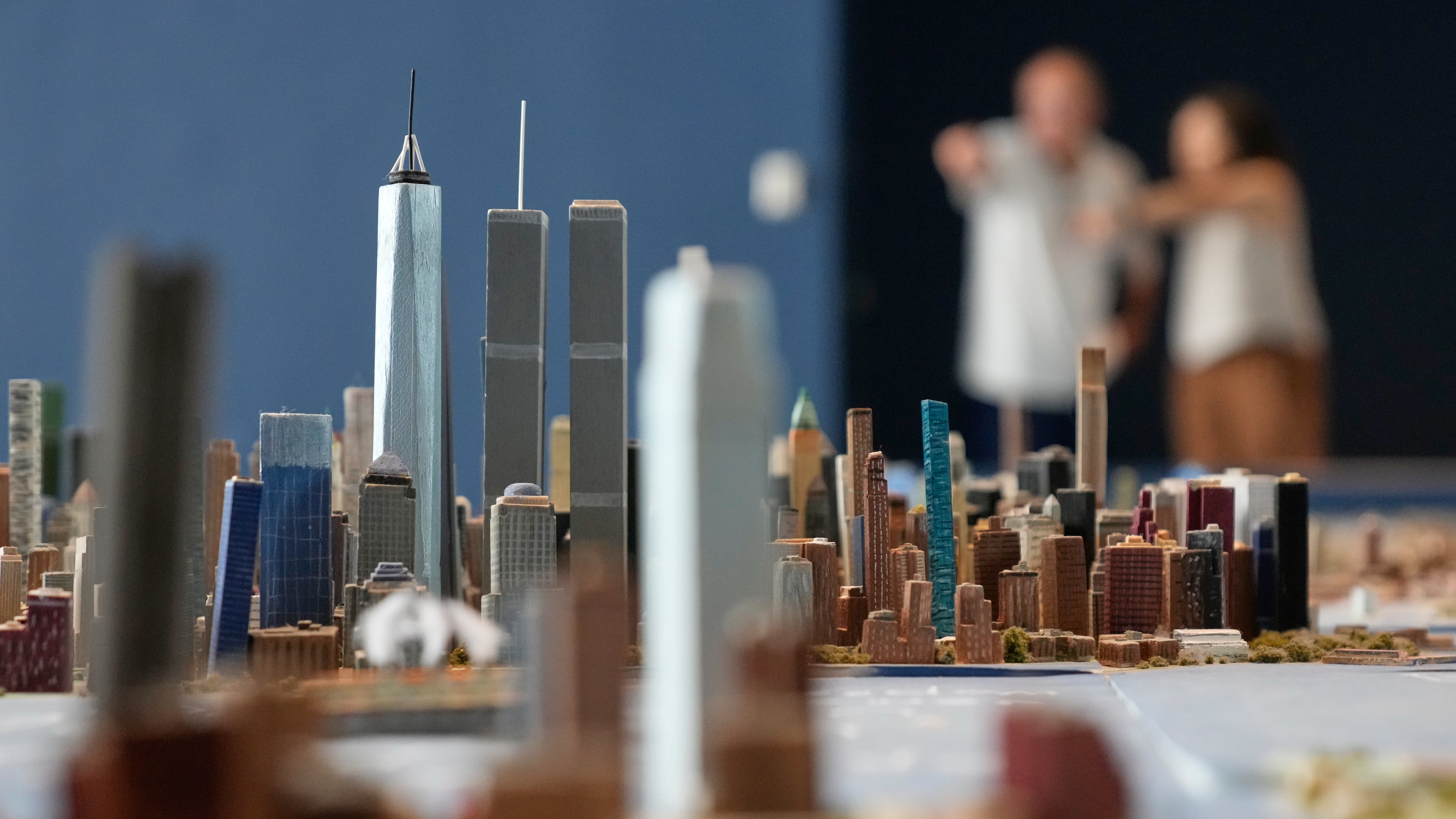 Lower Manhattan, featuring both the One World Trade and the Twin Towers, is seen on a large model of the New York City, made by Joe Macken, at the Museum of the City of New York in New York, Monday, Sept. 14, 2026. (AP Photo/Seth Wenig)