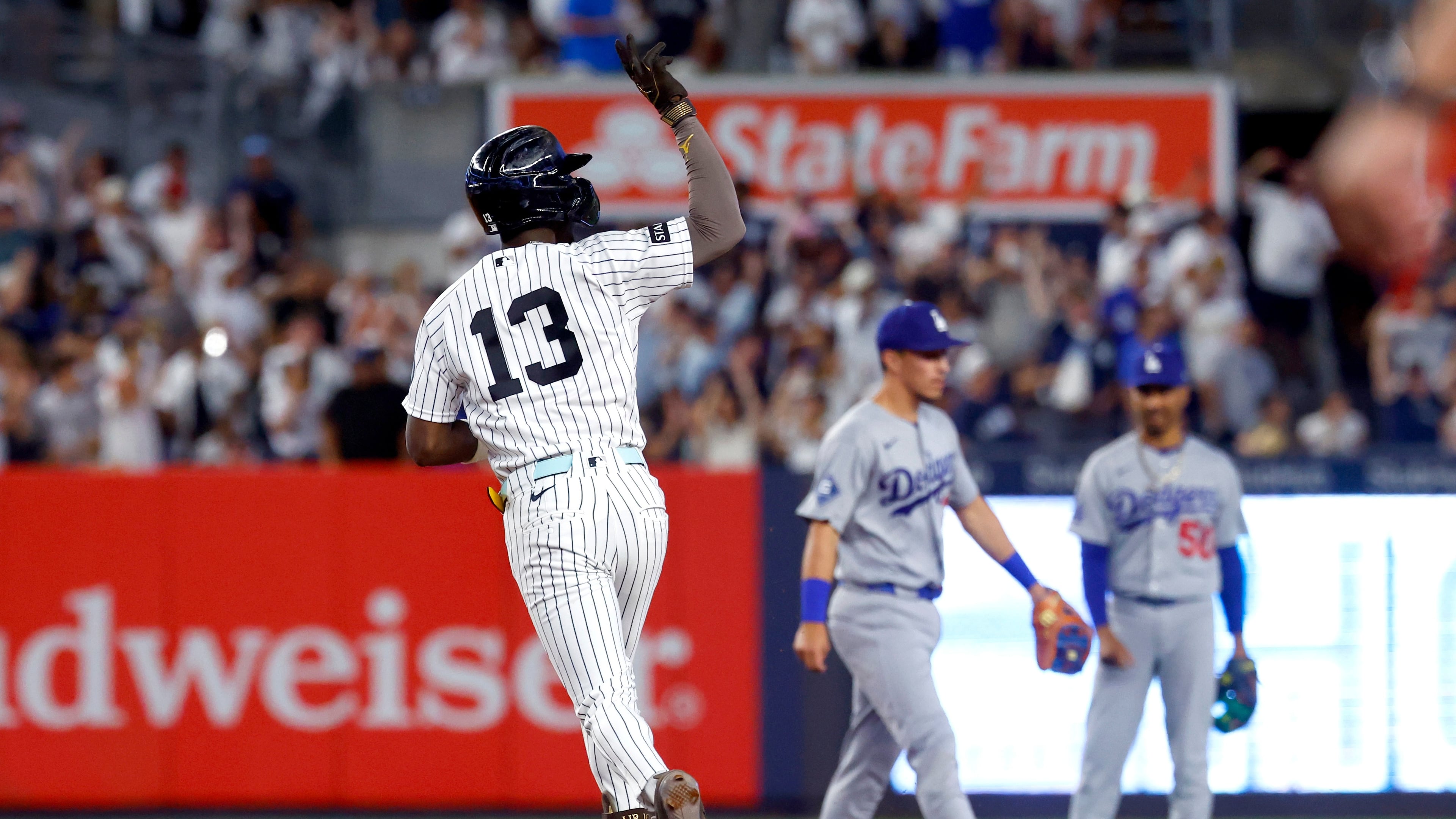 New York Yankees' Jazz Chisholm Jr. reacts running the base after hitting a home run against the Los Angeles Dodgers during the eighth inning of the second game of a baseball doubleheader, Sunday, July 19, 2026 in New York. (AP Photo/Noah K. Murray)