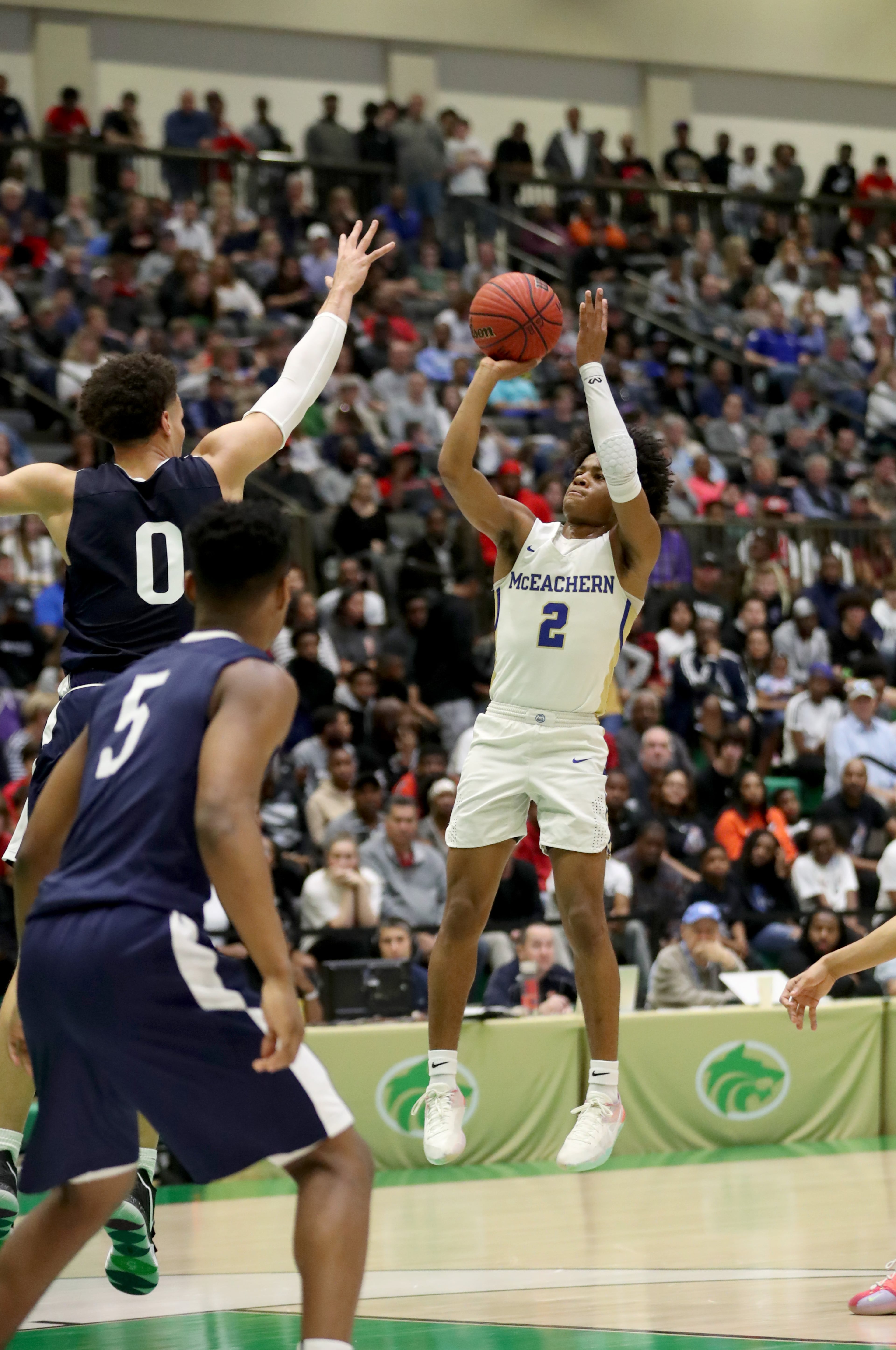 March 2, 2019 - Buford, Ga: McEachern guard Sharife Cooper (2) attempts a shot against Norcross forward Issa Muhammad (0) in the first half of the Class AAAAAAA semifinals at the Buford City Arena Saturday, March 2, 2019 in Buford, Ga. (JASON GETZ/SPECIAL TO THE AJC)