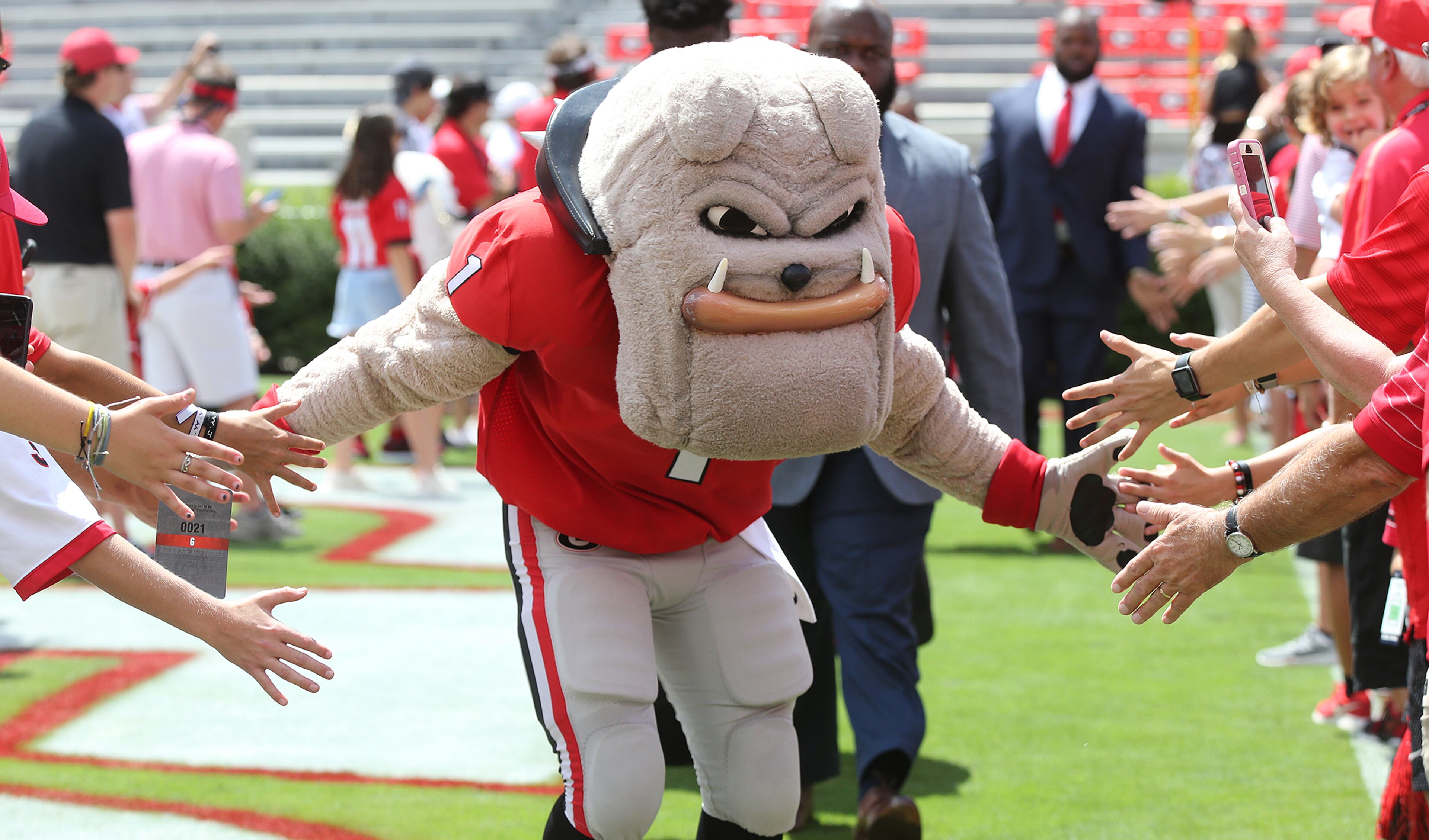 September 1, 2018 Athens: Hairy Dawg gives fans five during the No. 4 Georgia Bulldogs Dawg Walk arrival for the 2018 season opener against Austin Peay in a NCAA college football game on Saturday, Sept 1, 2018, in Athens. Curtis Compton/ccompton@ajc.com