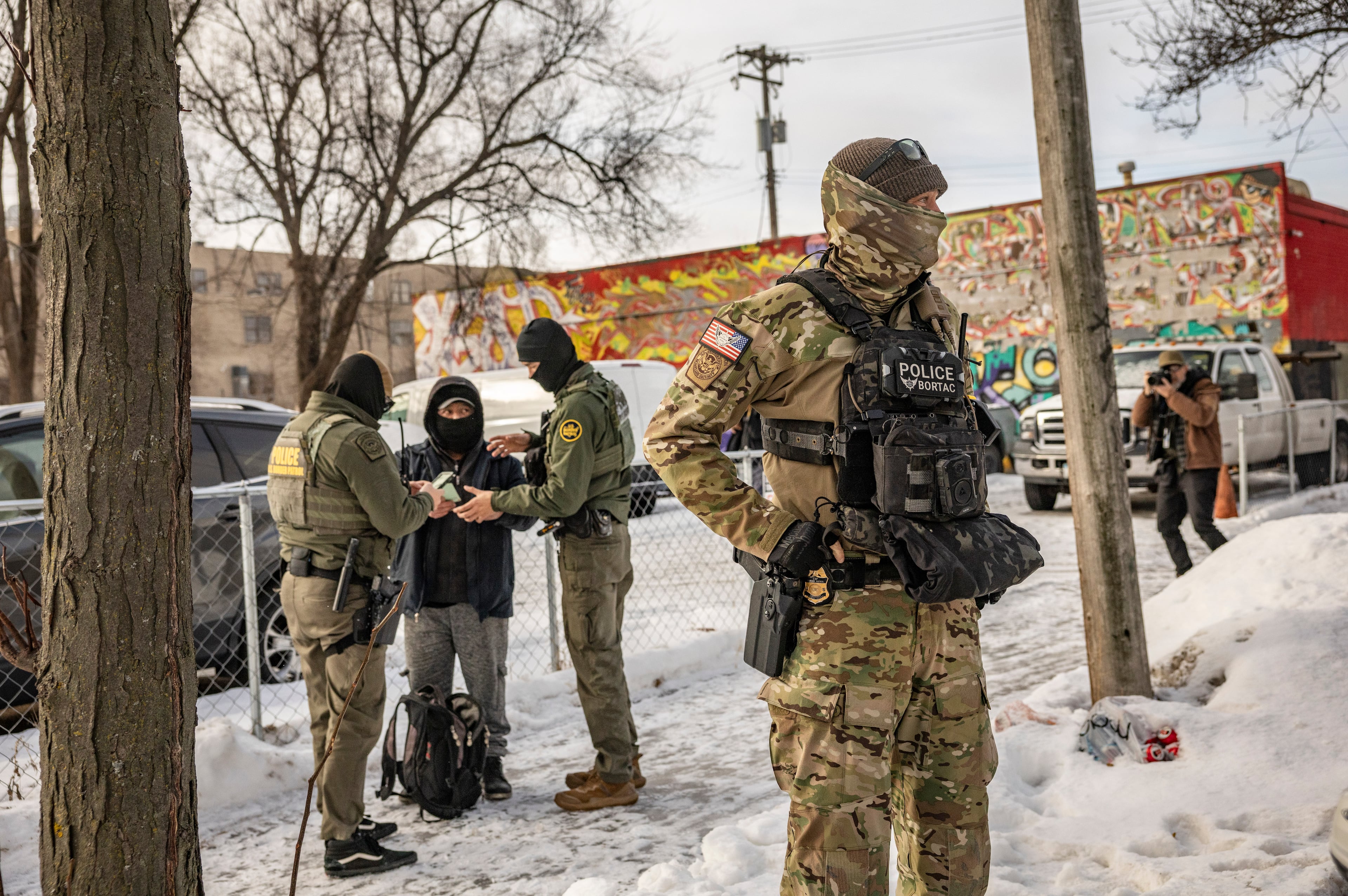 Border Patrol agents arrest a man in Minneapolis, Jan. 11, 2026. (David Guttenfelder/The New York Times)