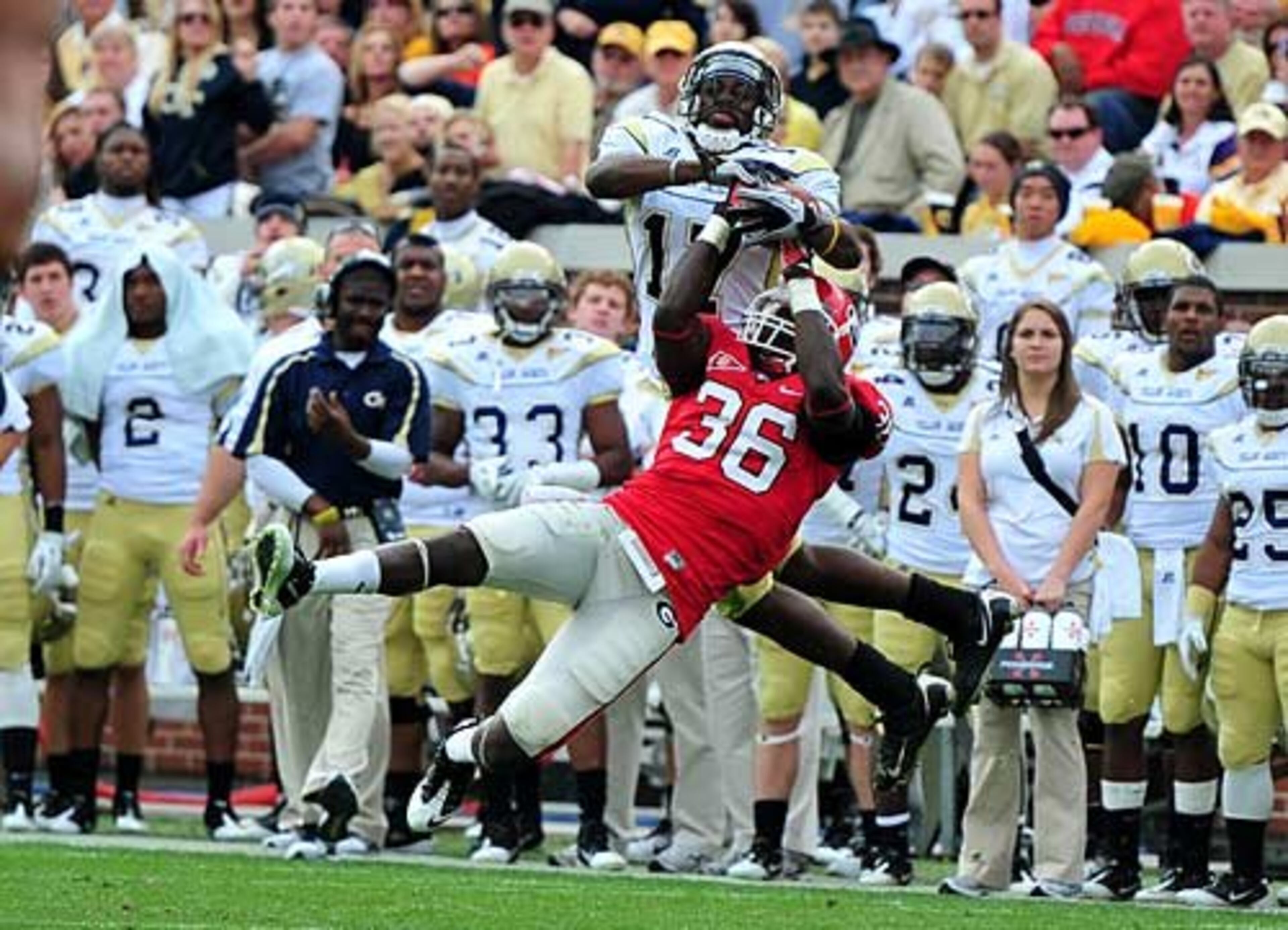 Georgia safety Shawn Williams intercepts a ball intended Georgia Tech receiver Orwin Smith.