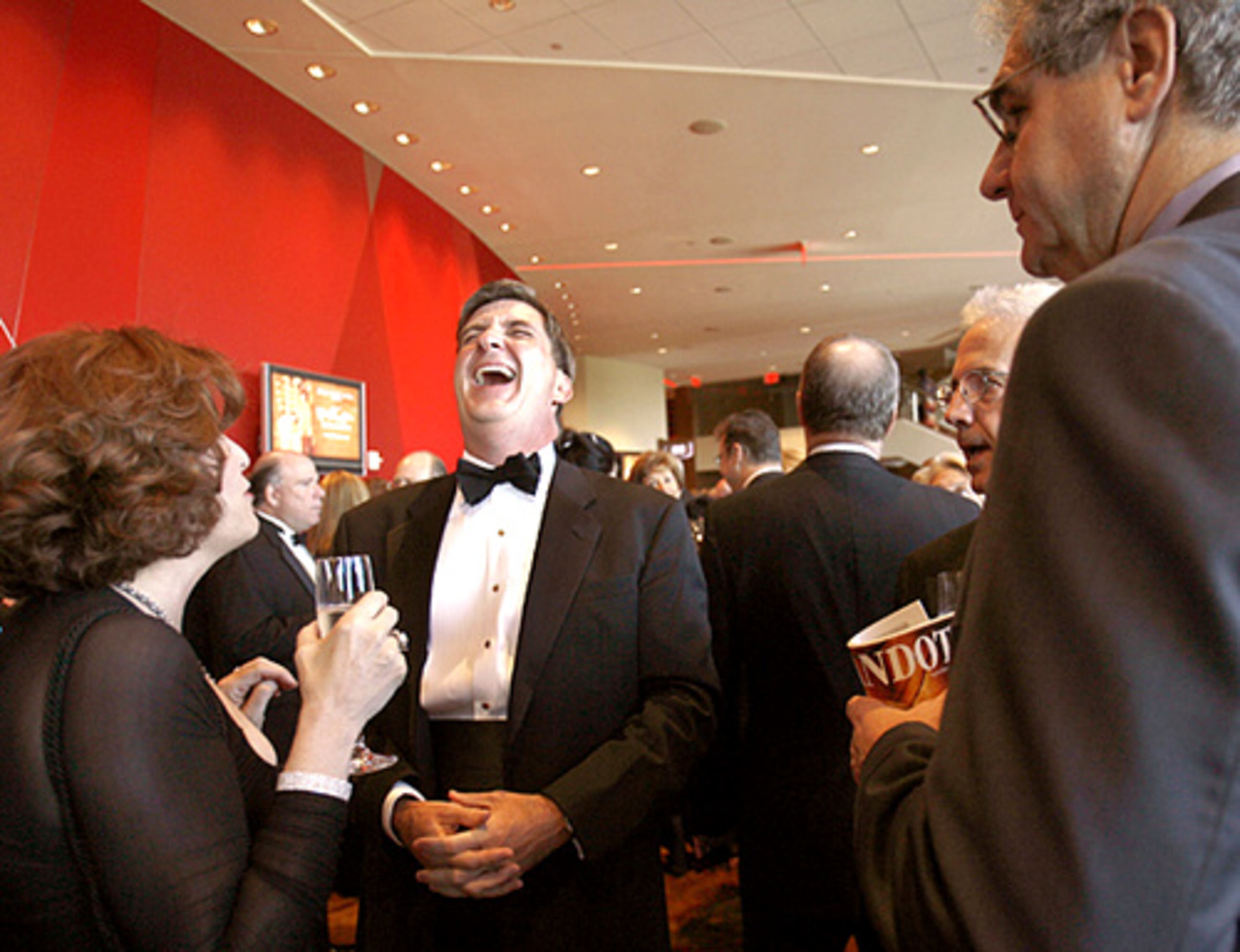 Alyce Toonk (left) and Tim Sheehan share a laugh during the champagne reception.